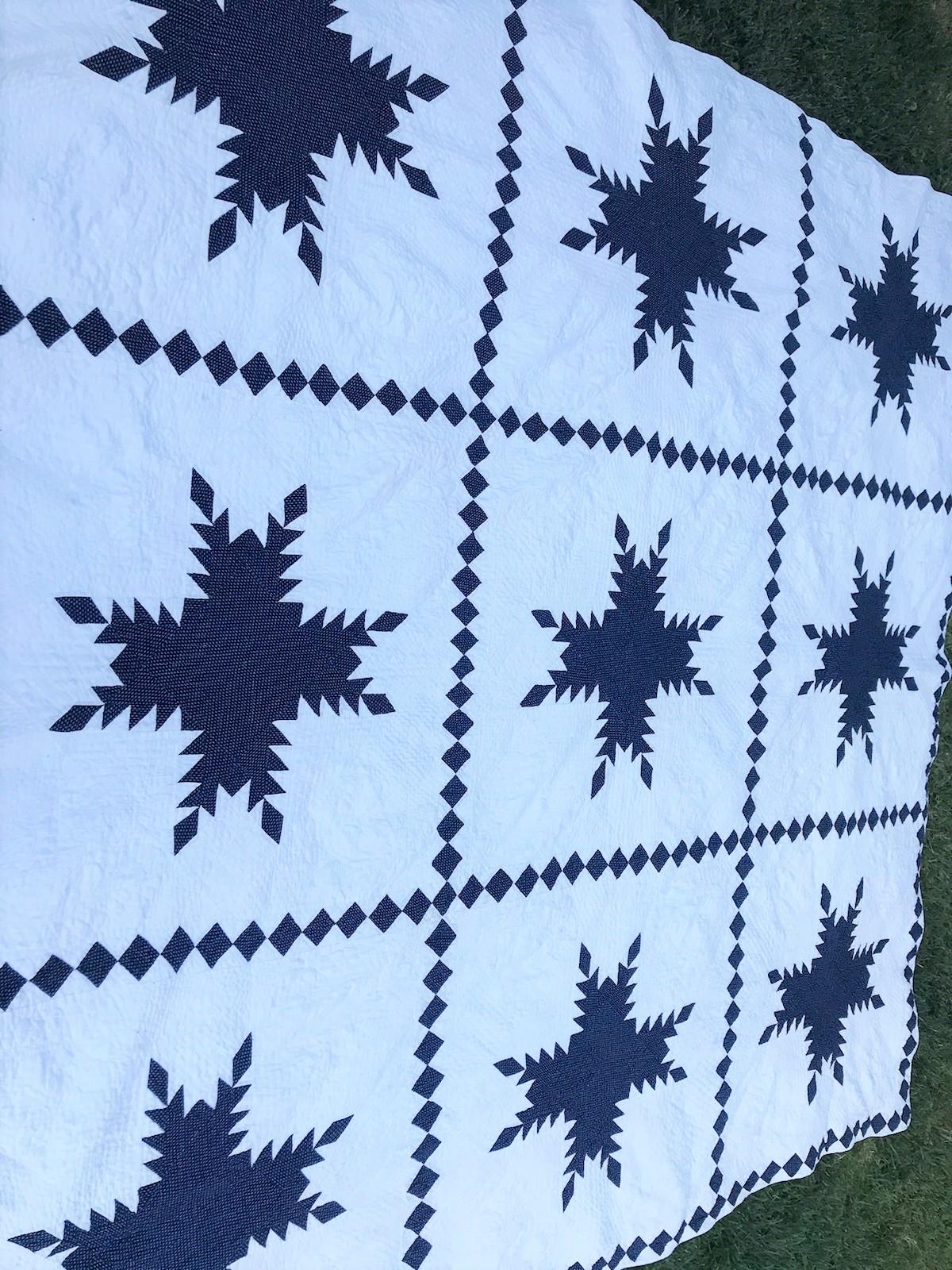 19th century blue and white feathered star quilt with amazing quilting and piecework. This border is amazing and in very good condition.