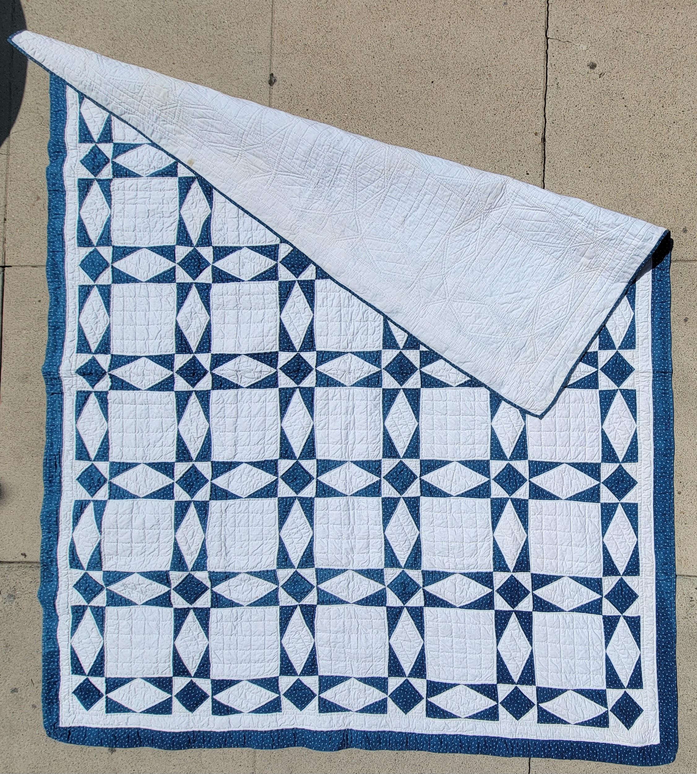 19th century Blue & white touching stars quilt in fine clean condition.Fine quilting and piece work. Such an unusual pointed stars quilt and geometric border.