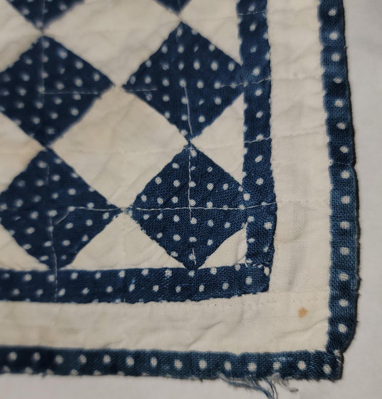 This fine hand made & sewn blue & white little doll quilt is in fine condition & has very fine piecing & quilting. The little gem has double borders and comes to us from a private collection.