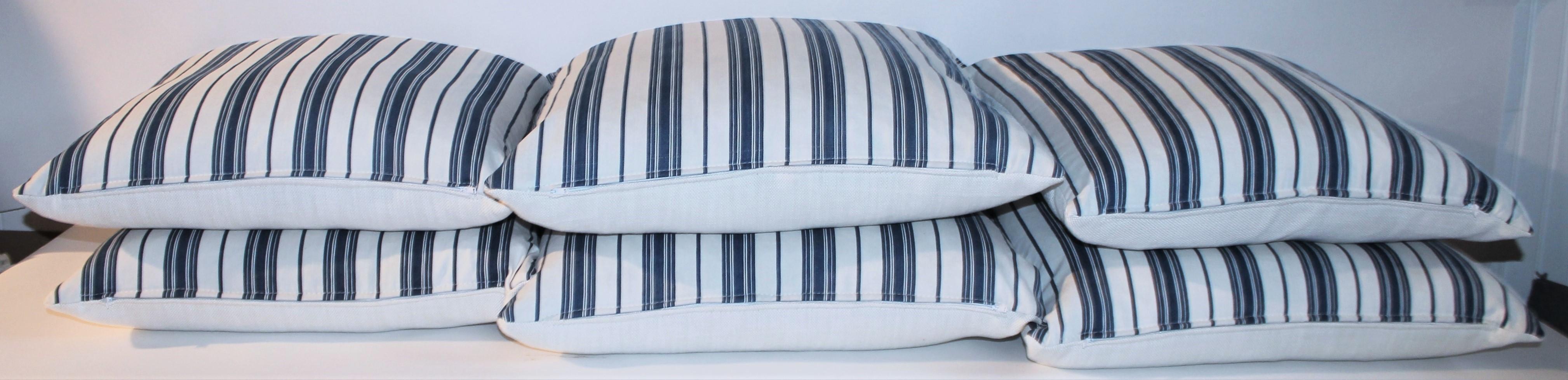Fantastic 19Thc blue & white ticking pillows with white cotton linen backings. The inserts are down & feather fill. Two pairs in stock of 20 x 20 & two pairs of 22 x 22 in stock. Sold in pairs.