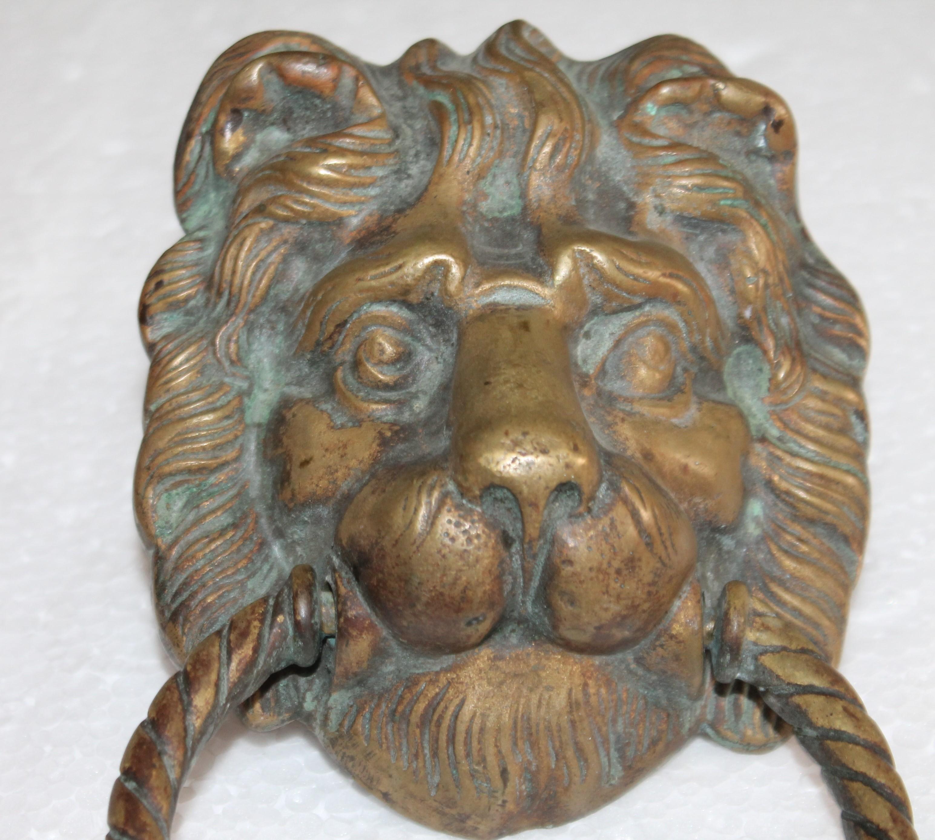 This large brass lion head door knocker is in great condition and was found in New England. The condition is very good.