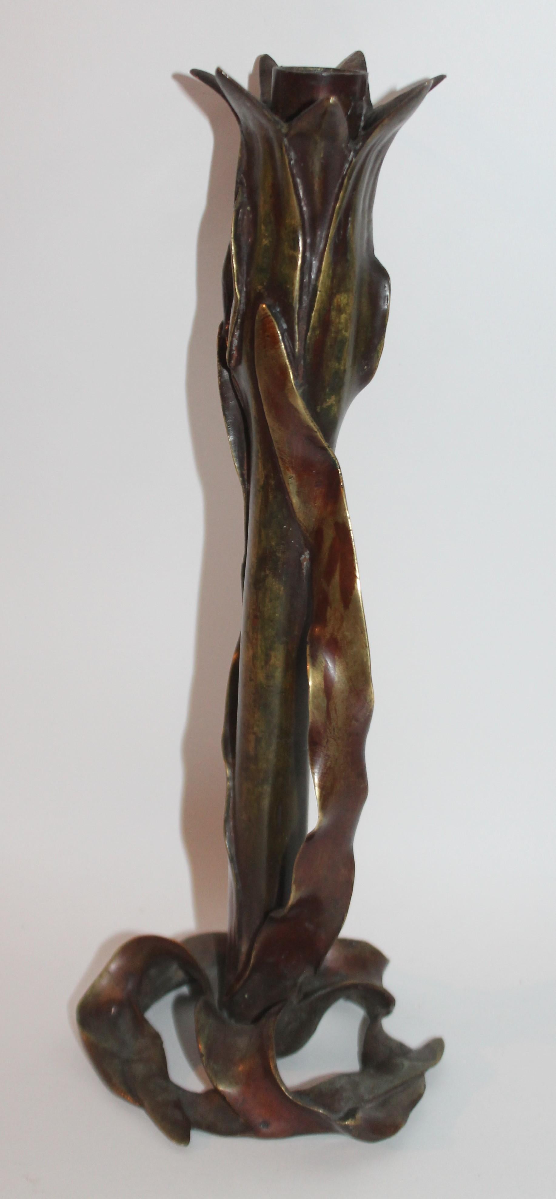 This handcrafted bronze candlestick holder is depicting a corn stalk. It is unsigned with an amazing patina.
