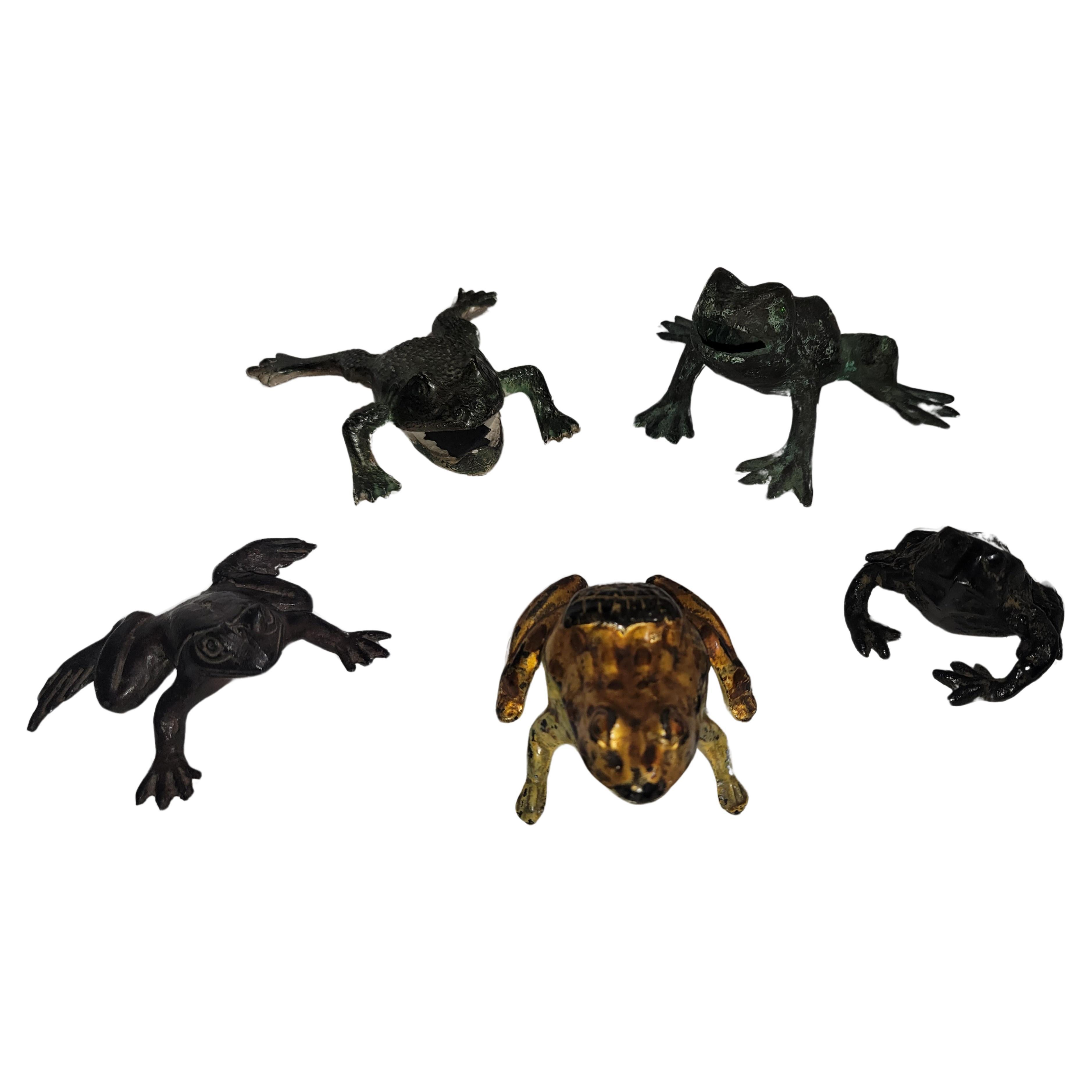 This amazing collection of bronze and iron frogs are all hand made or hand forged.The gilded frog is a advertisement & match safe in one.The others are hand made.