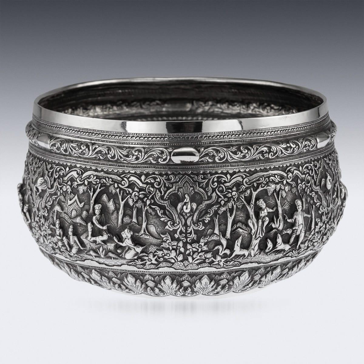 Antique late 19th century Burmese (Myanmar) solid silver repousse' bowl, repousse' decorated in high relief with scenes from the Burmese mythology, representing various figures and animals in a landscape, with very detailed scenes, the base