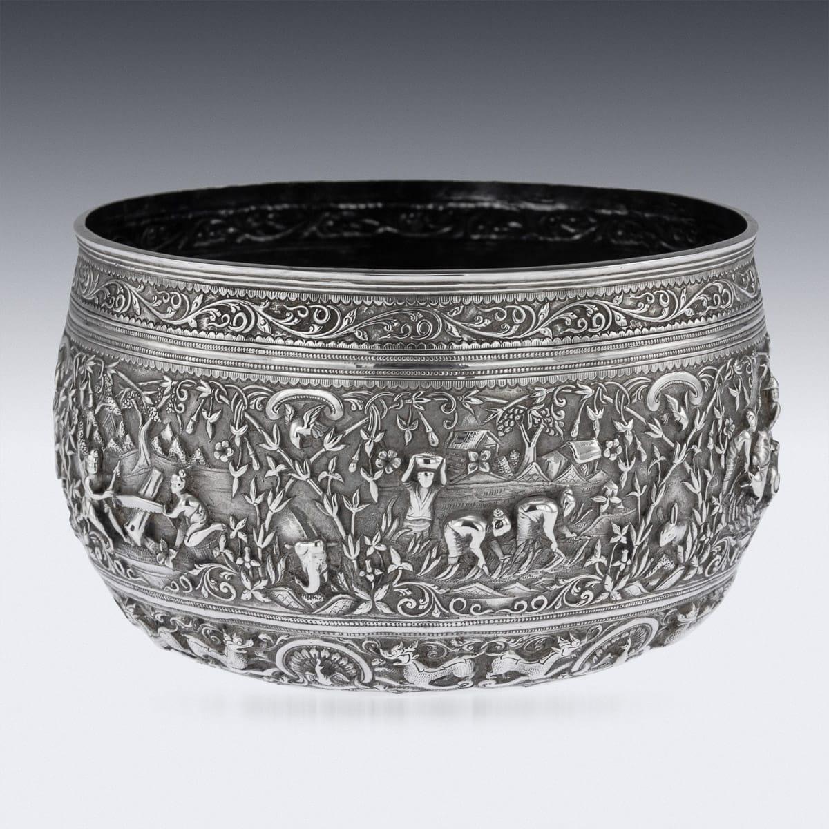 Antique late 19th century Burmese (Myanmar) outstanding solid silver repousse' bowl, repousse' decorated in high detail and relief with scenes of agriculture, villagers sailing, villagers sawing wood, transporting goods with two water buffalo,