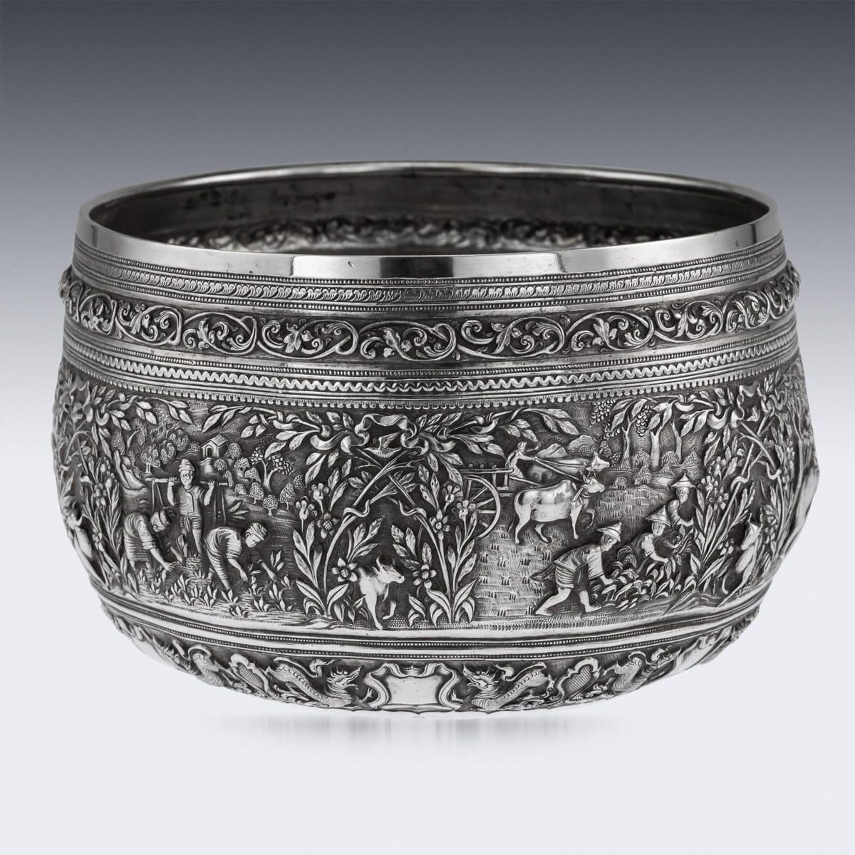 Antique late 19th century Burmese (Myanmar) exceptional solid silver repousse' bowl, repousse' decorated in high detail and relief with scenes of agriculture, elephants helping to move timber, villagers sawing and carrying wood, ploughing the ground