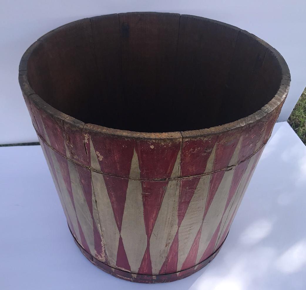 19th century original red and cream painted geometric design bucket. The bucket is in good condition and has wonderful aged and worn patina.