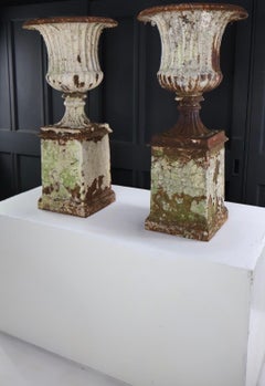 19thc Cast Urns On Plinths
