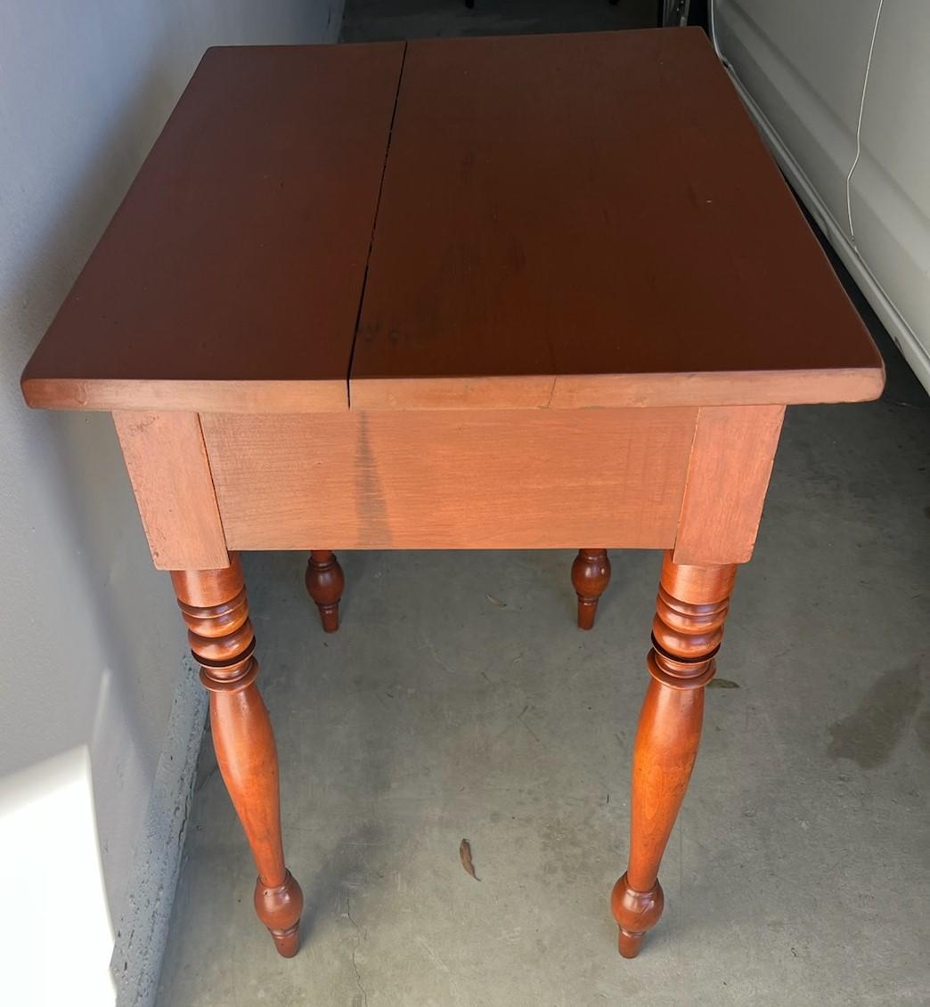 19Thc Cherry one drawer stand with turned legs and wood peg & dovetailed drawer. This New  England night stand or end table.