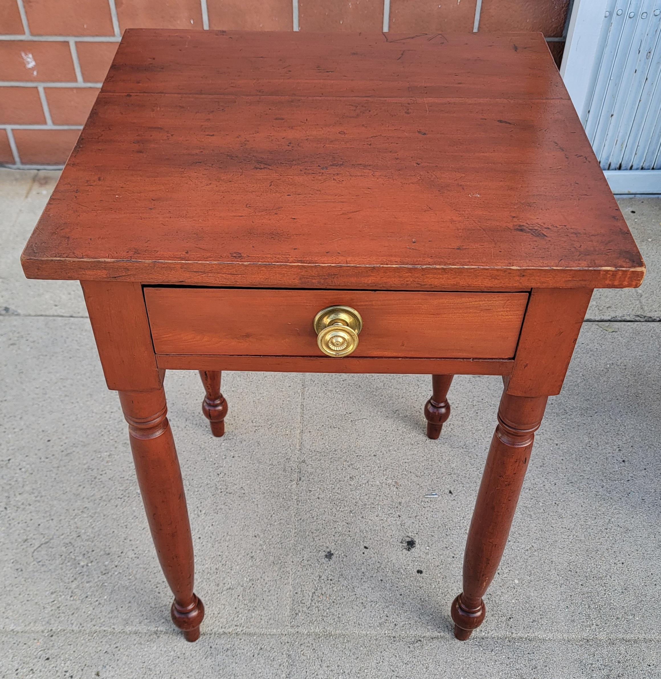19Thc Cherry side table or night stand from Pennsylvania.The fine one drawer table is in pristine condition and has the original brass drawer pull.
