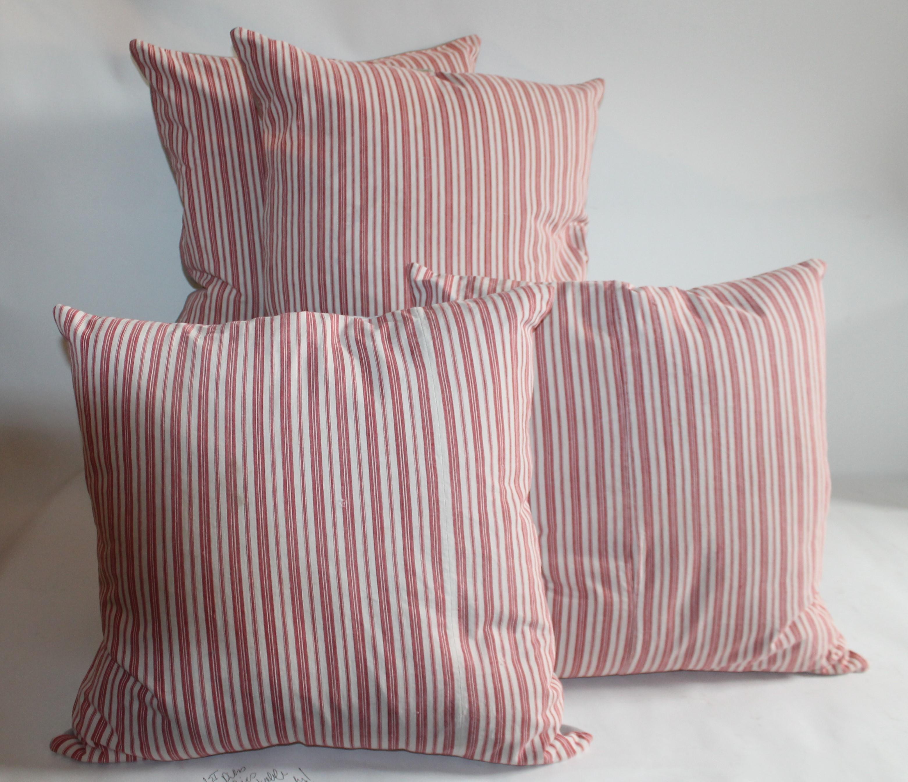 American 19th Century Cherry Striped Ticking Pillows / Collection of Four For Sale
