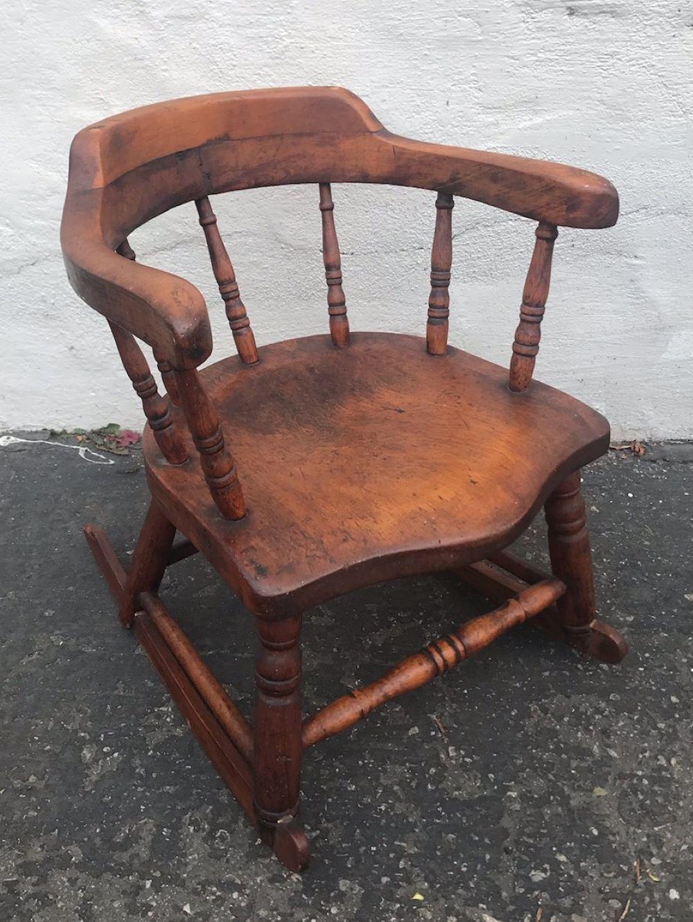 19th century handmade wooden child's rocker in great condition. This child's rocker is very strong and has been checked for strength and stability. Has a replaced rocker on the right side.