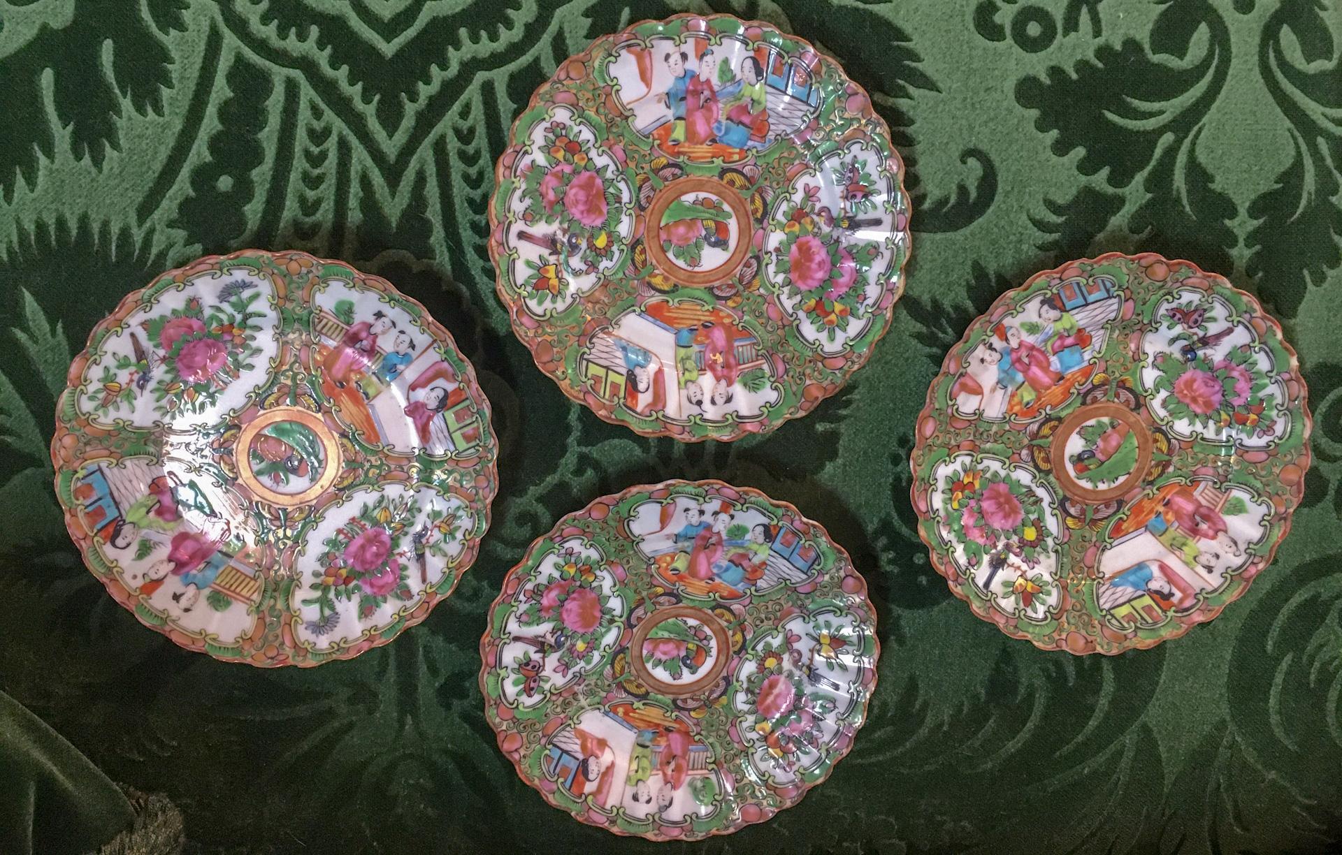 This very rare set of ten Chinese export Rose Medallion bread or small dessert plates were hand painted in the first half of the 19th century with overglaze enamels of pink, green, blue, yellow, gold, rust ad black over a white background. It is