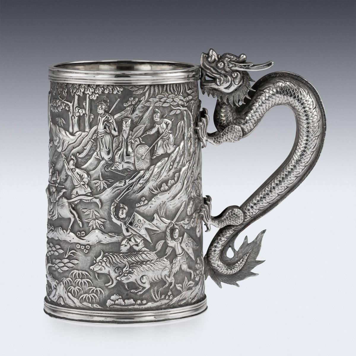 Antique late 19th century Chinese export solid silver mug, of traditional shape and large size, the body is embossed with beautiful battle scenes in relief depicting Chinese warriors fighting amongst forest landscape, double walled, the front