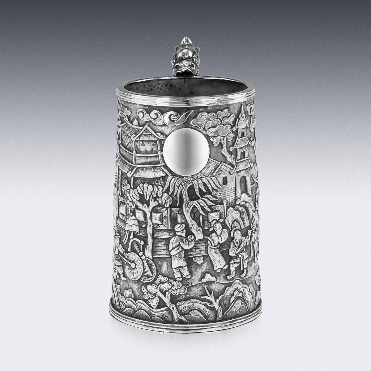 Antique 19th Century Chinese export solid silver mug, of traditional shape and size, the body is embossed with beautiful scenes in relief depicting Chinese warriors and nobility amongst city landscape, double walled, the front centering with an