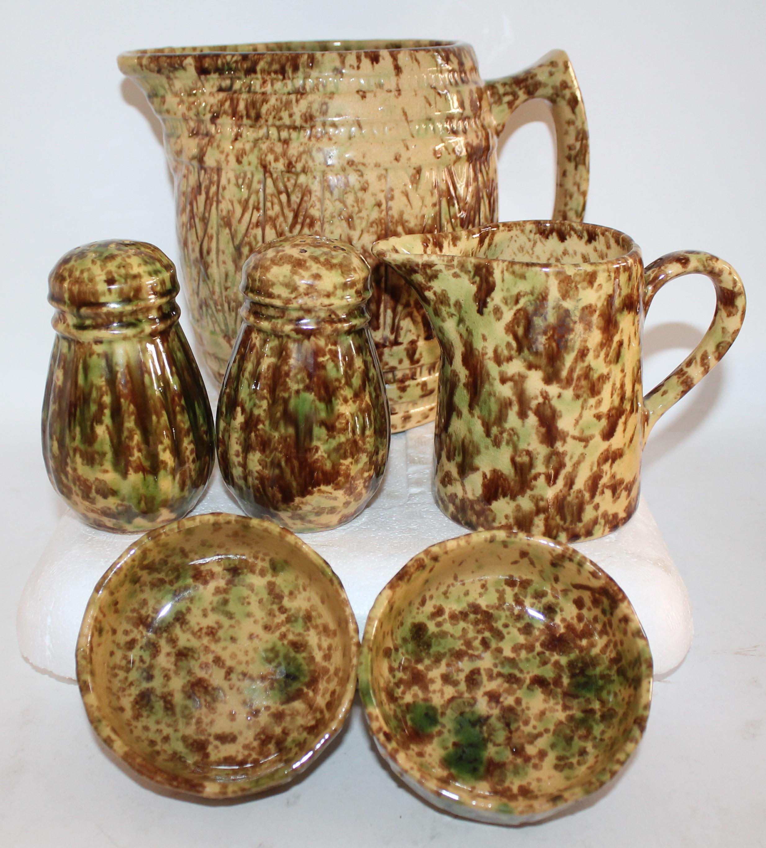 This collection of Bennington pottery is from New England and is all in very good condition. It is like a form of yellow ware with brown and green sponged glaze. This was made in Bennington, Vermont in the late 19th century. It is very rare to find