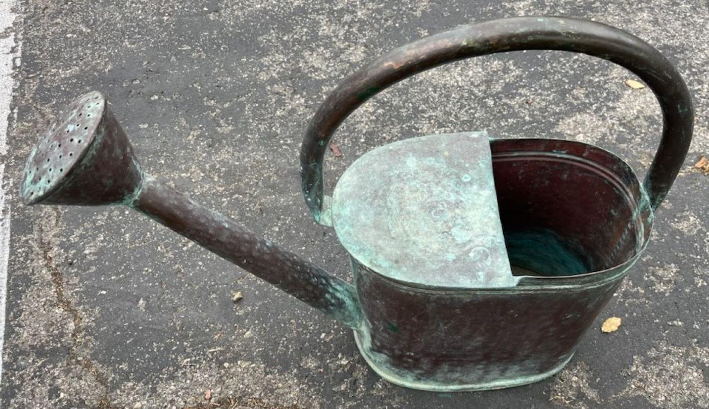 19thc century all copper construction watering can. Fine age and patina to this watering can from age and use. Beautiful age marks on the sides. This watering can is usable or as a decorative piece.