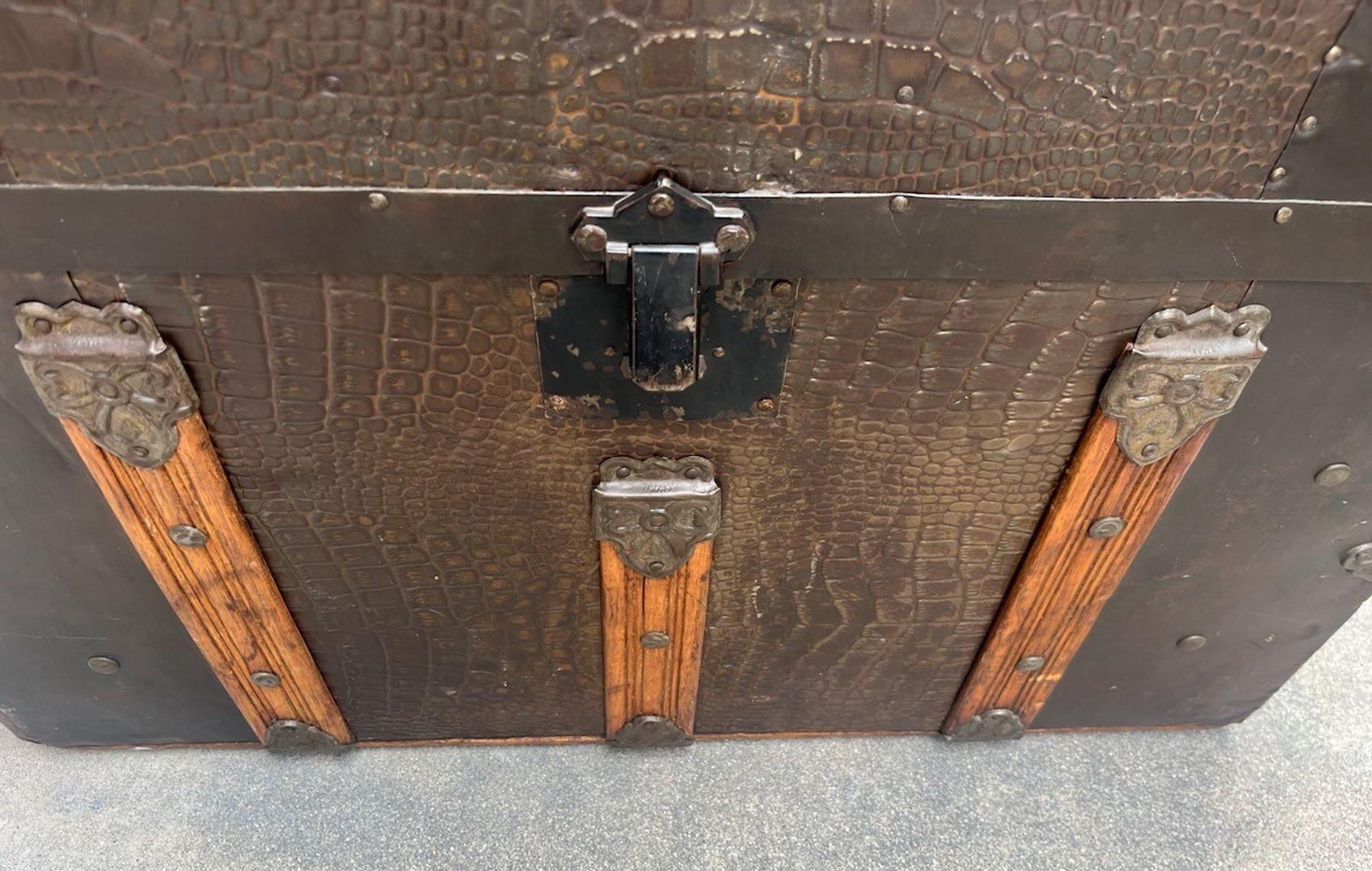 19thc Amazing steamer trunk in fine condition and leather handles on the sides.The inside has been re-papered with new wall paper in a vintage floral design w/original paper labels left inside the trunk.The inside tray is original as well.This is