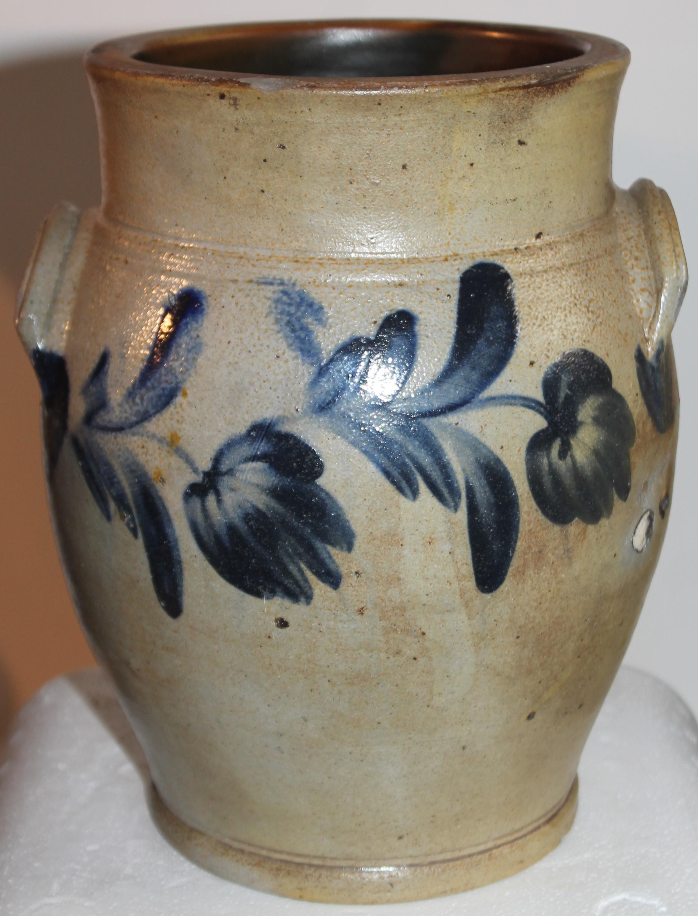 This fine hand decorated stoneware crock was found in Pennsylvania. It is in very fine condition with a couple very minor chips on the base.