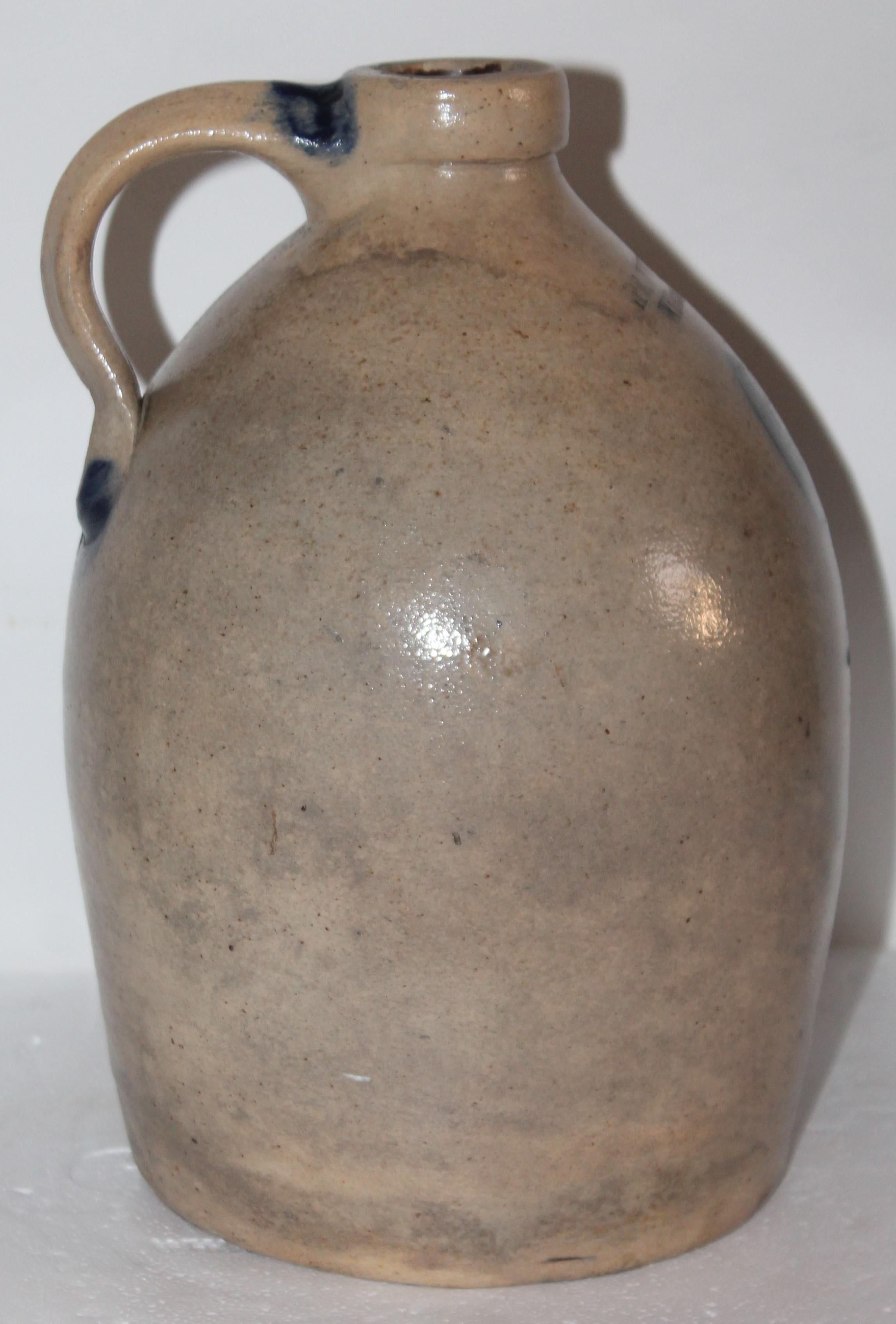19th century Decorated salt glaze jug signed Nichols & Co., Williamsport, Pa. circa 1870-1880. Minor chips on base with no cracks.
