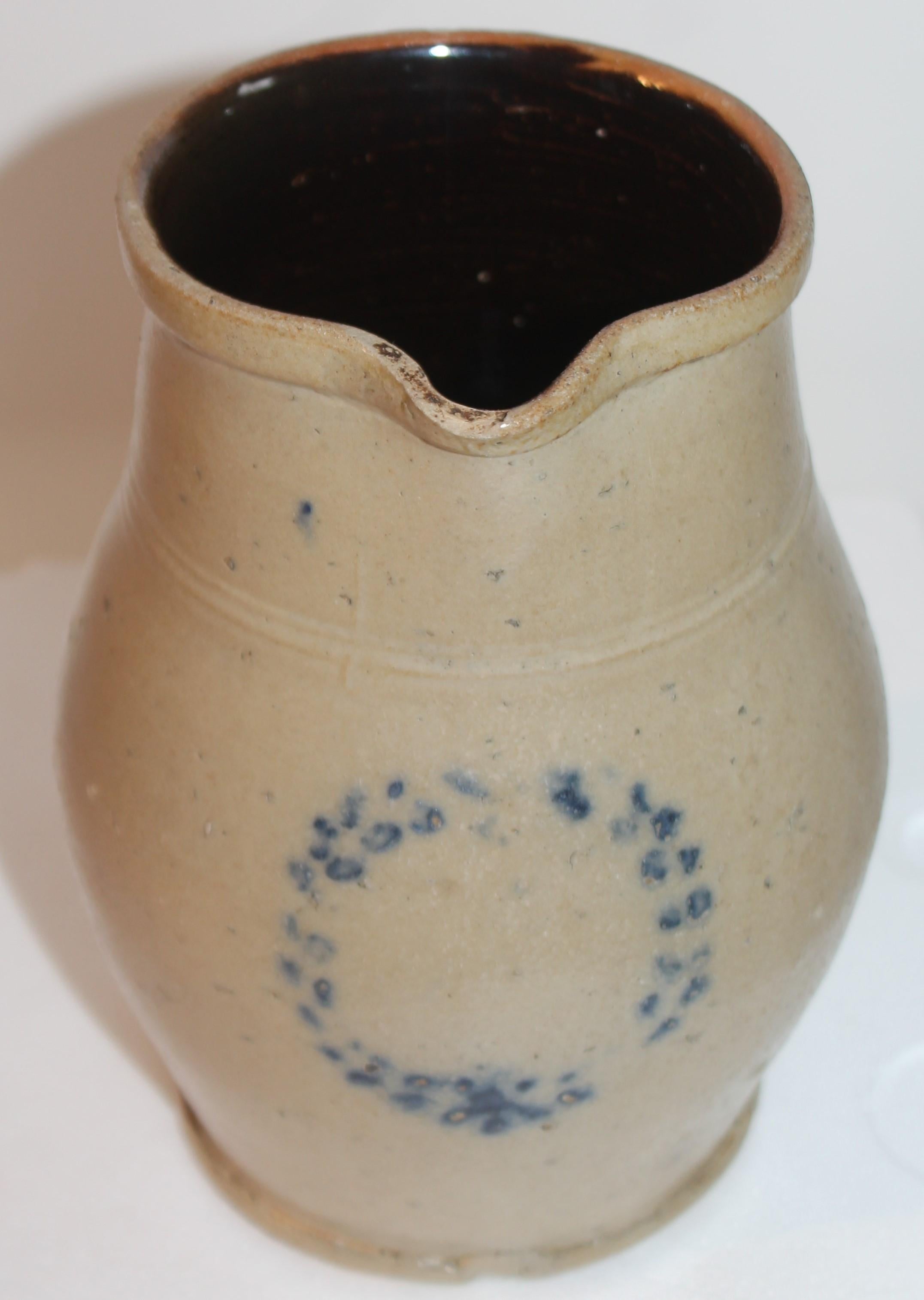 This fine hand made & hand painted pottery pitcher is in fine condition. This is such a rare piece and most unusual.