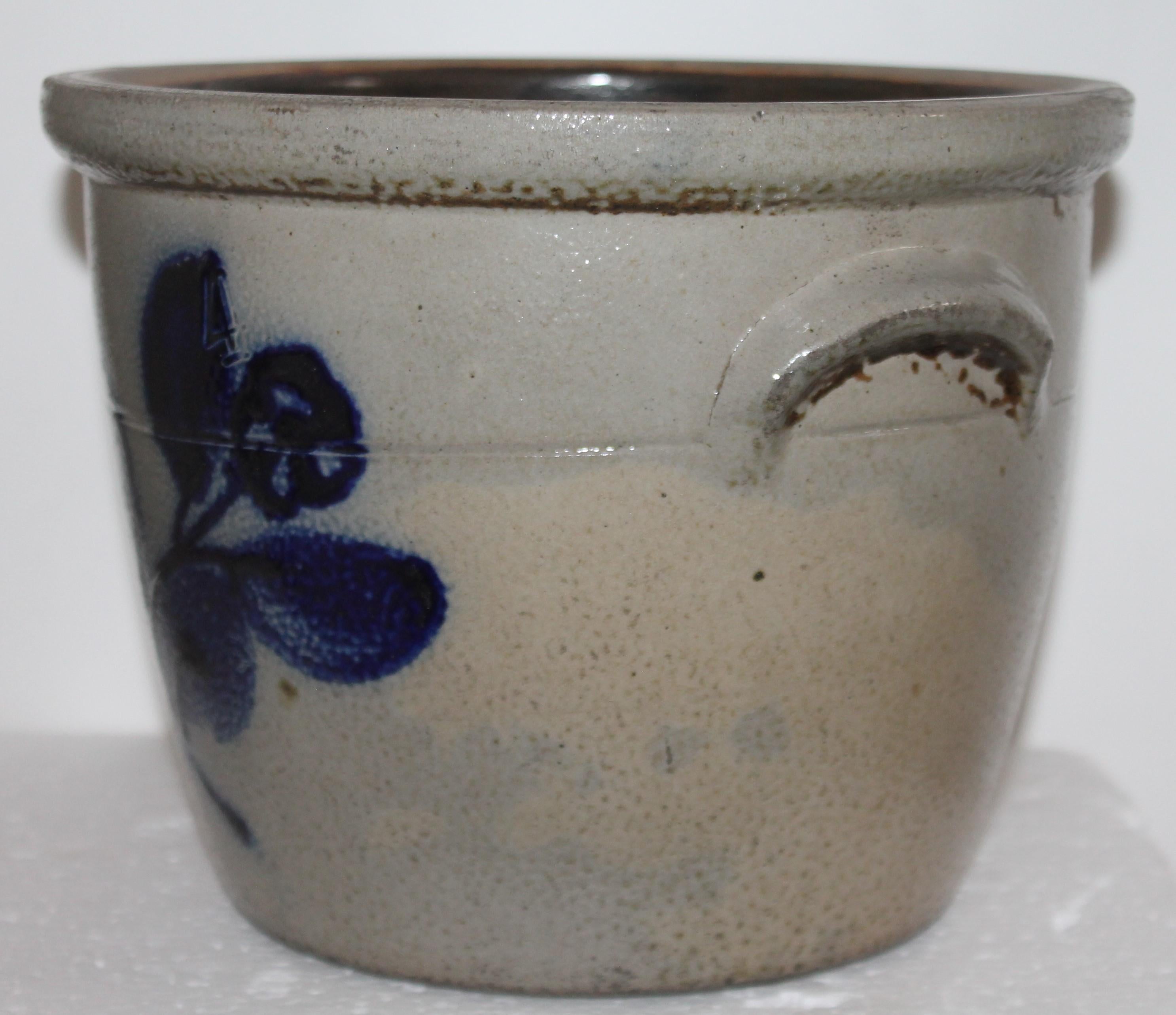 19th century original decorated stoneware crock with double handles in fine condition. Fantastic folky floral design.