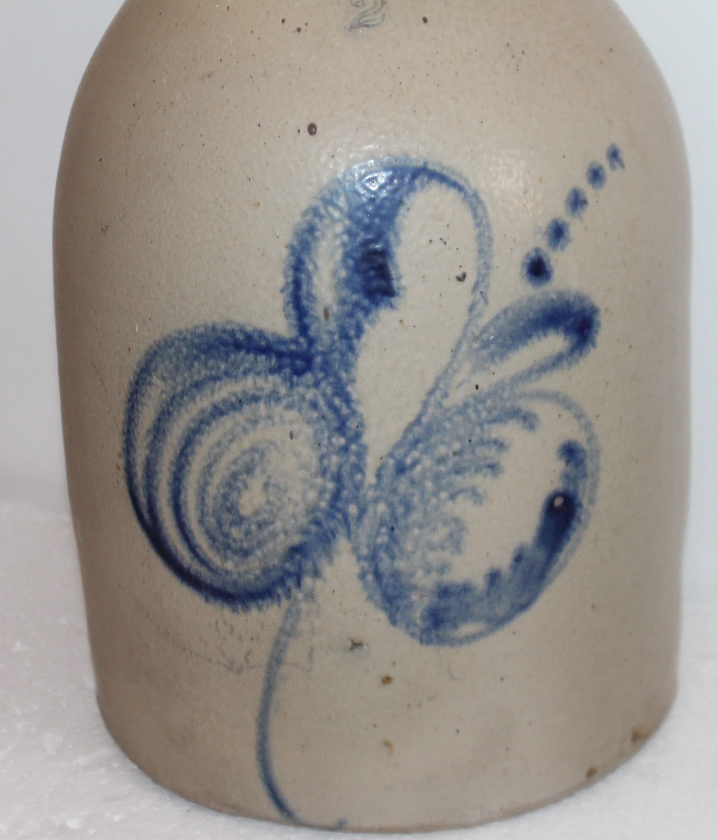 This 19th century blue decorated stoneware jug has a interesting design and is signed by the maker J.S.Tamaka.
