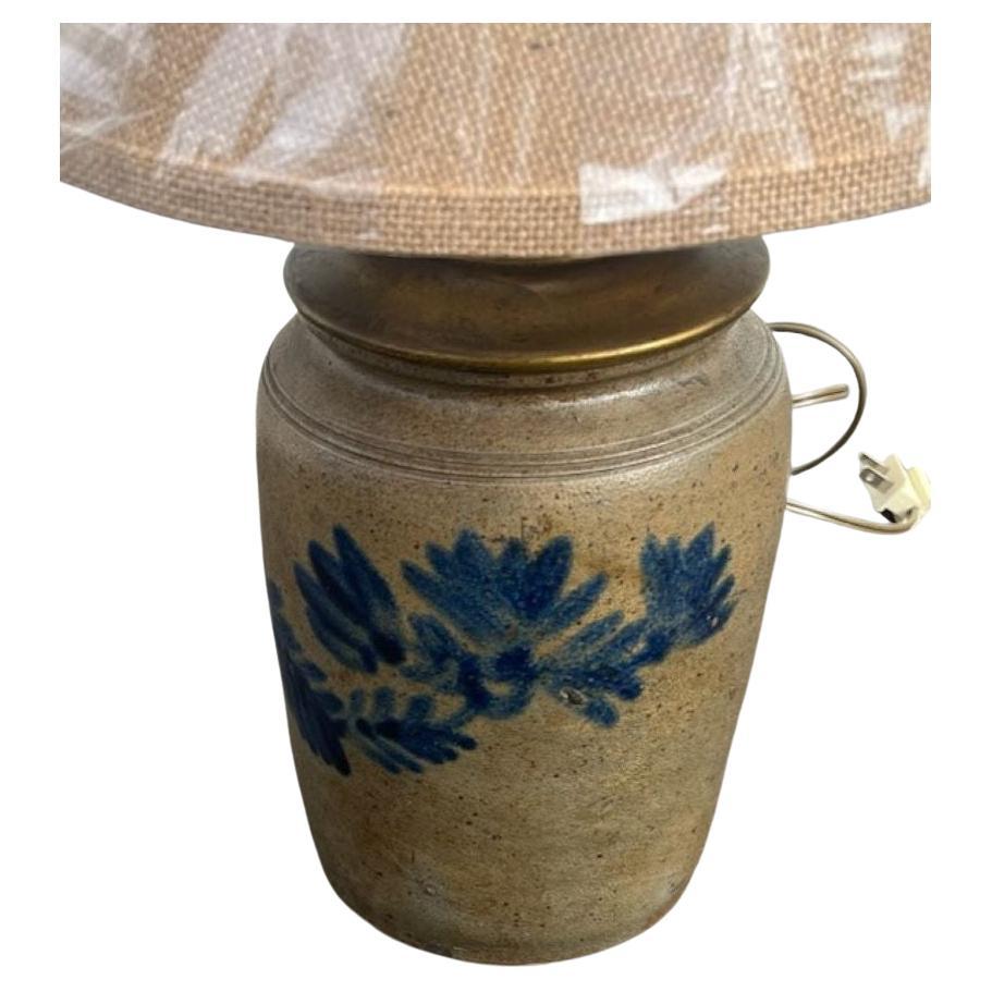 19thc Crock lamp that has been turned into a lamp from an original 19thc pottery crock. It is newly wired and new linen shade.
The blue cobalt blue floral design is a great design. 
