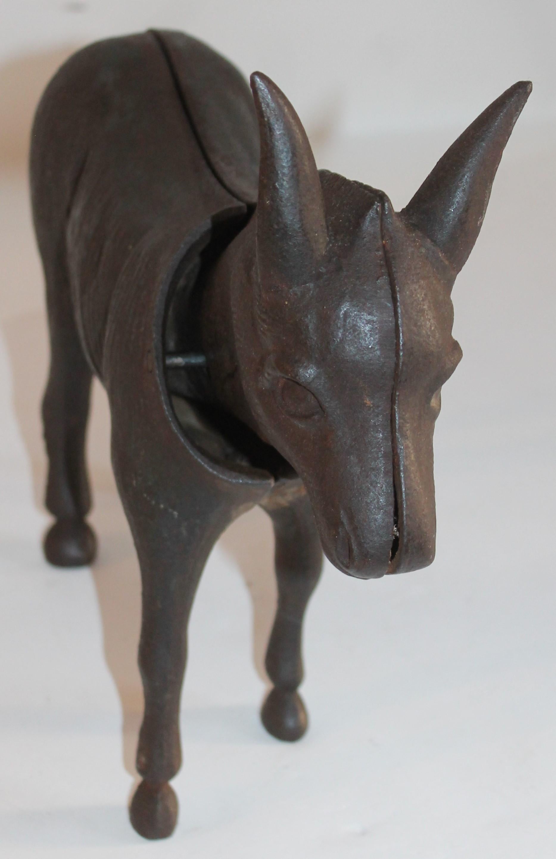 This folky and heavy donkey door stop is in fine condition and in working order. The head bobs back and forth when moved. It has a wonderful untouched patina.