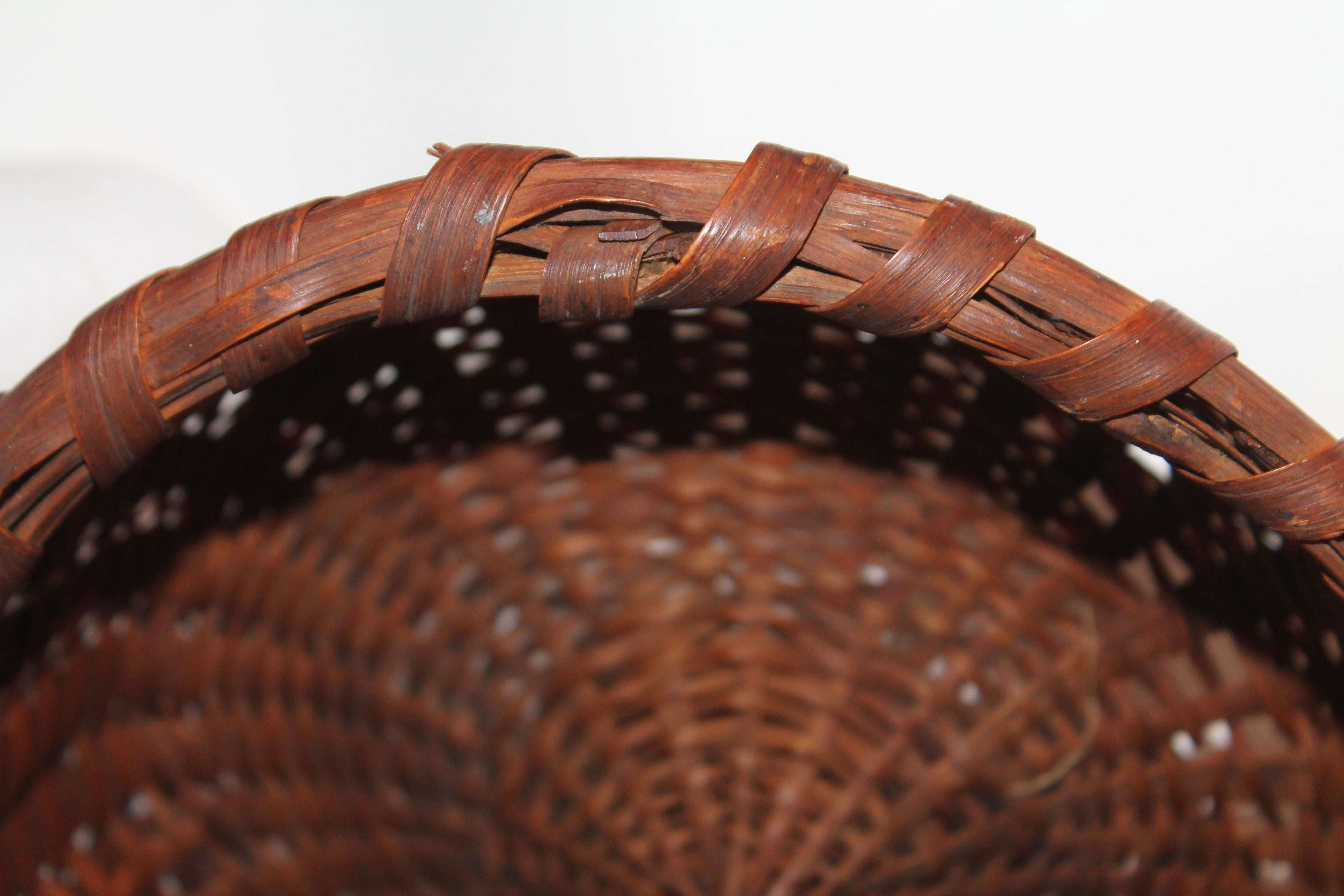 Hand-Crafted 19th Century Early Basket with Kick Up Base