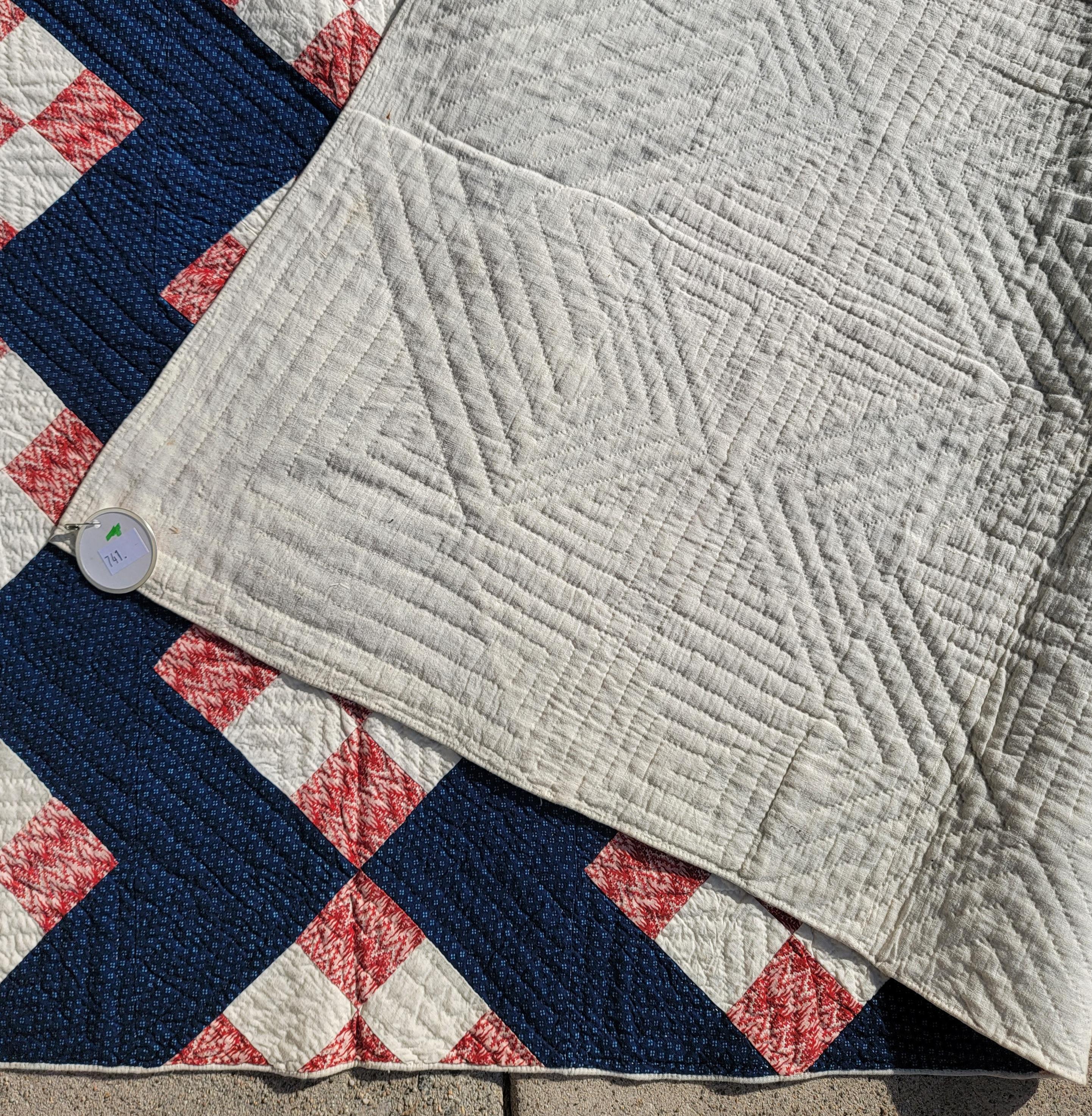 19thc nine patch chain with a streak of lightning indigo blue calico back round in fine condition.This New England quilt is in pristine condition.