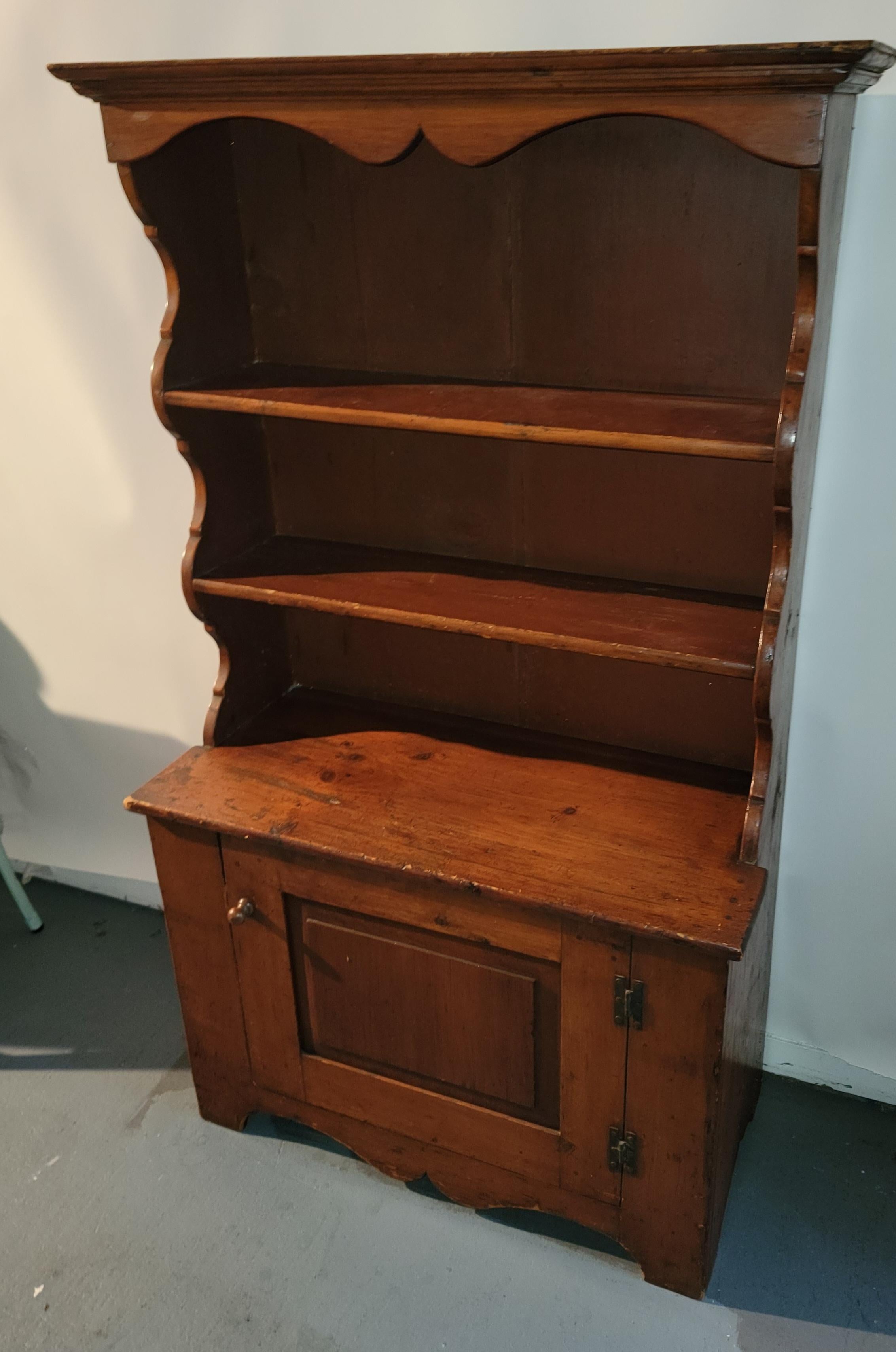 Early 19thc amazing pine step back cupboard with fantastic shelving & plate rails. This fine diminutive wall cupboard could be great in a small kitchen or bedroom or study for a book collection. It would be great in bathroom too ! Love the form.