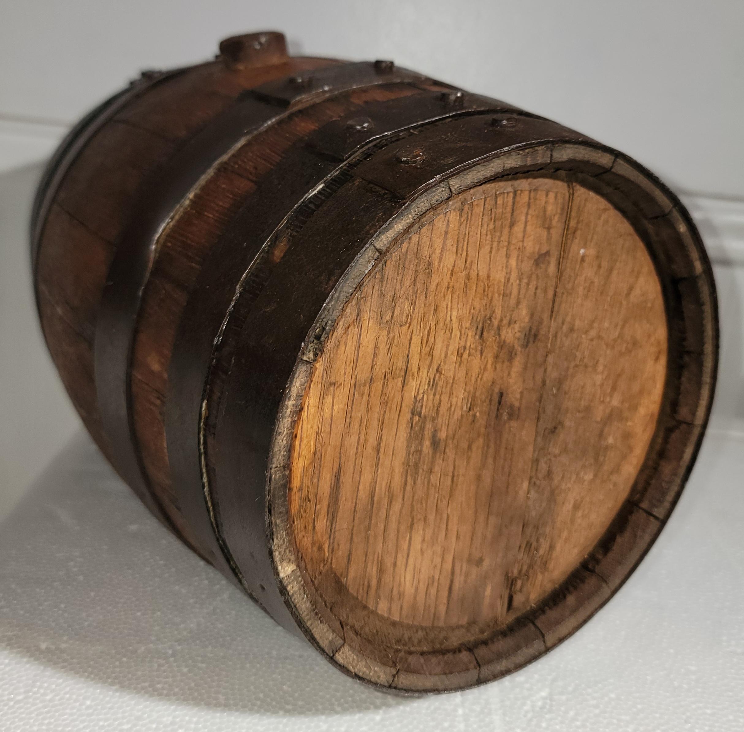 This 19thc primitive whiskey barrel was found on a ranch in the mid west and is in fine condition.The barrel is very tight and in great condition.Rare size and great on a shelf or a bar for display.