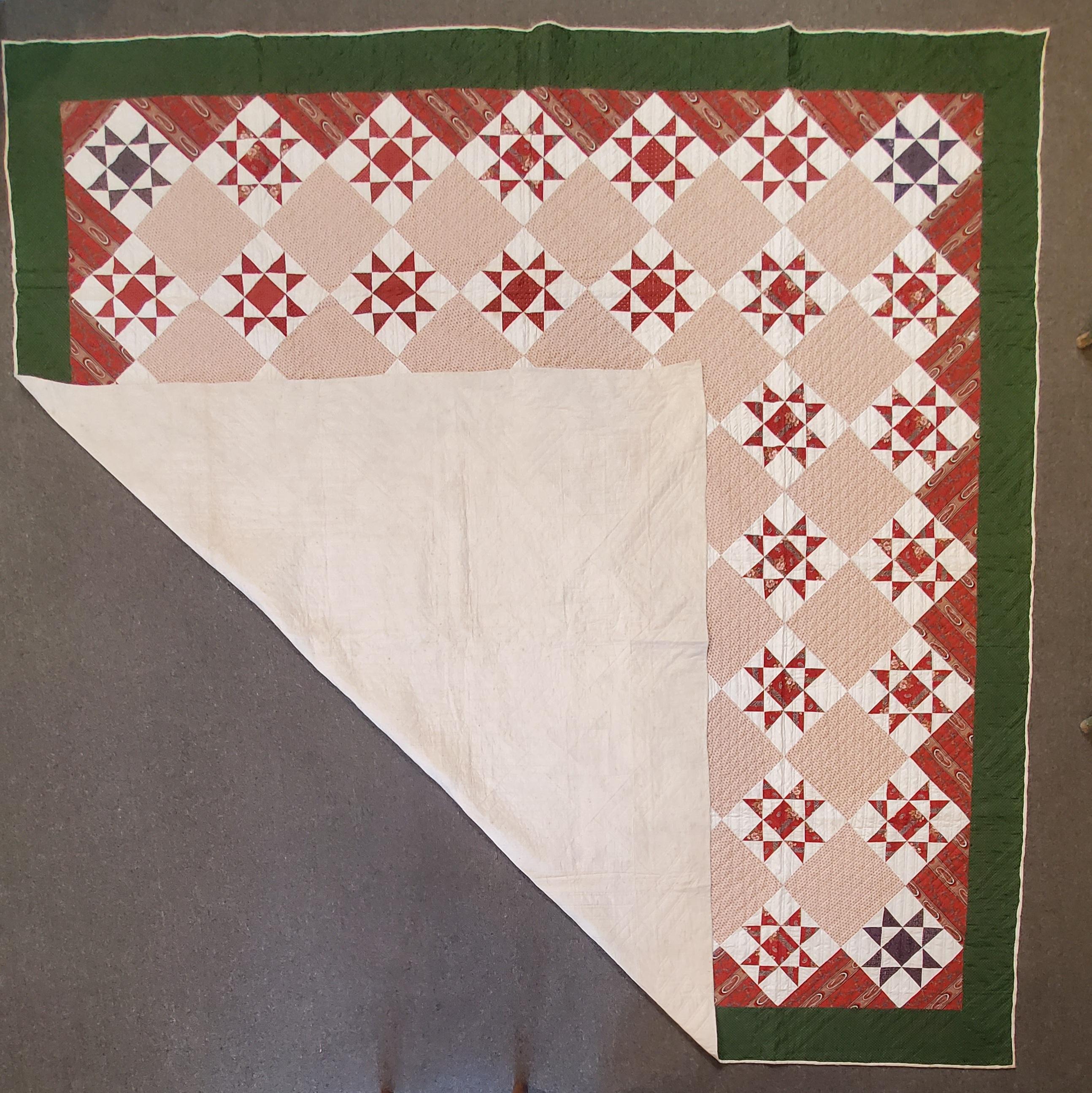 This fine eight point star quilt is in pristine condition with a couple minor tiny spots. Mostly posted on the back side. This is a very large quilt.