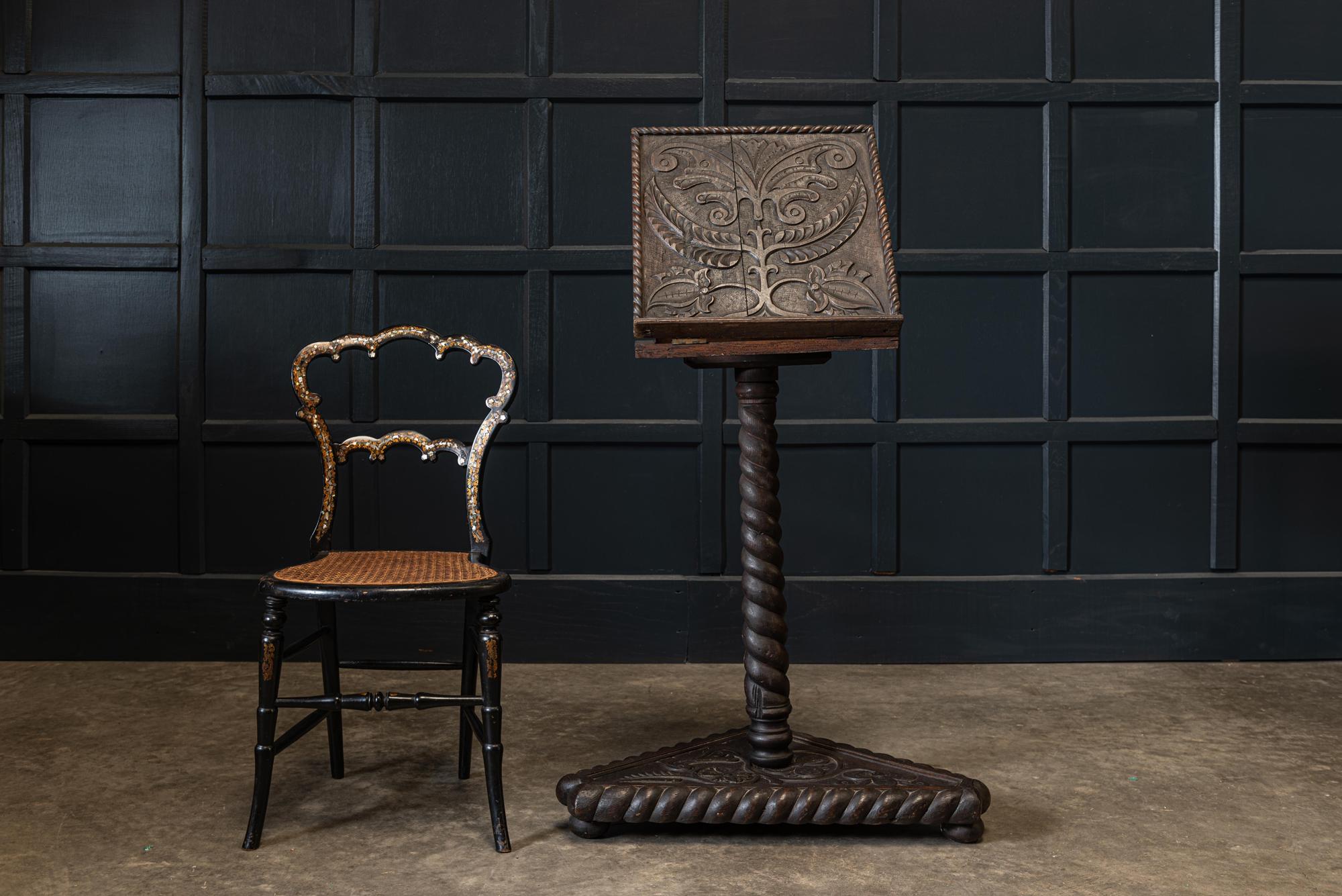 19th century English carved oak bible reading stand,
circa 1870.

Carved oak reading stand with adjustable and rotating top mounted on a bobbin turned pedestal.

Measures: Closed H 80 x W 40 (top) x D 41cm
Base W 67cm.
Lid open 110cm