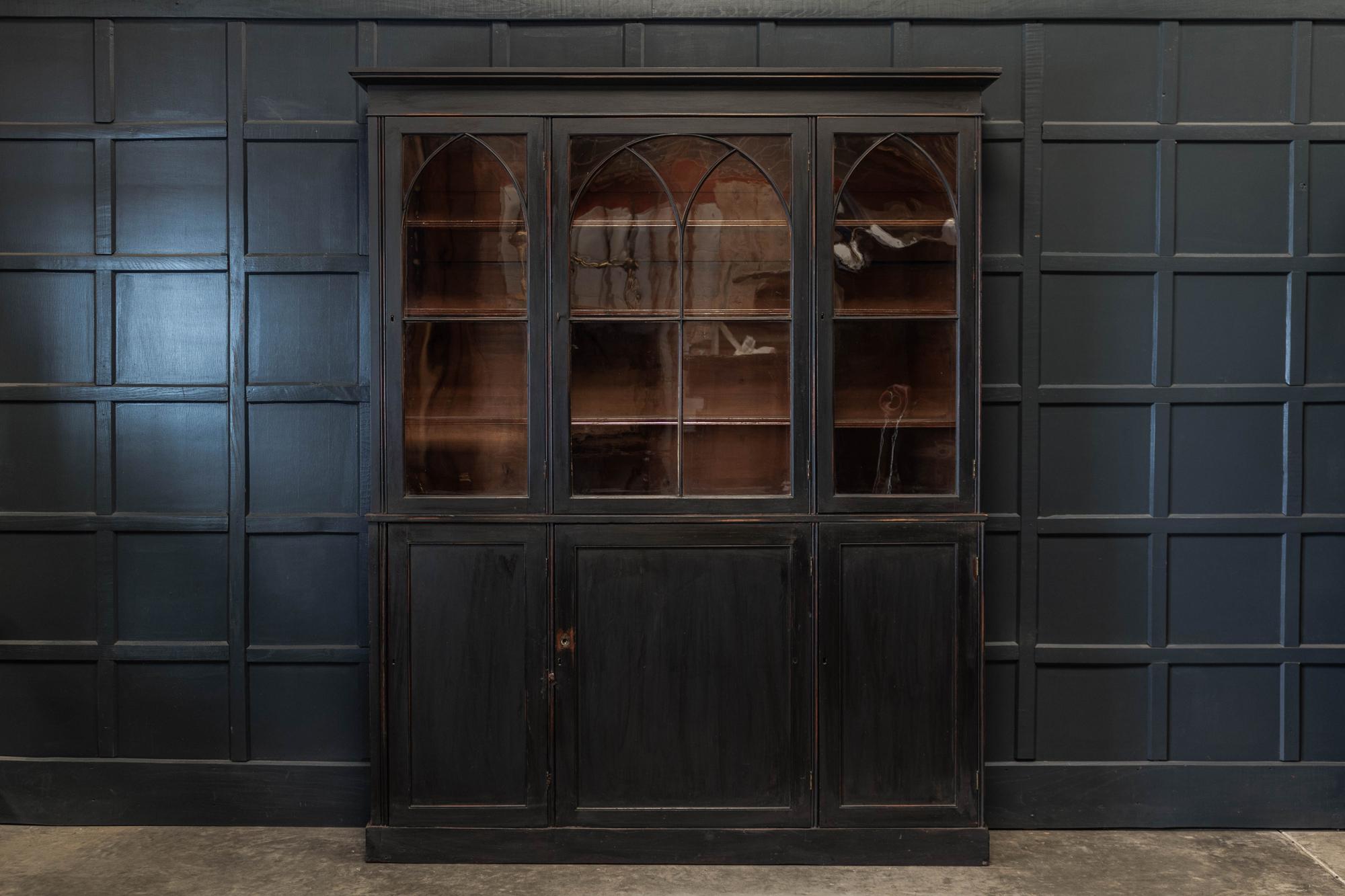 Circa 1880.

19thc English ebonised mahogany estate made arched glazed bookcase
Excellent scale with original brass hardware, handblown glass and locking key.
Adjustable top cabinet shelving. A narrow depth making it a versatile piece.

(slightly