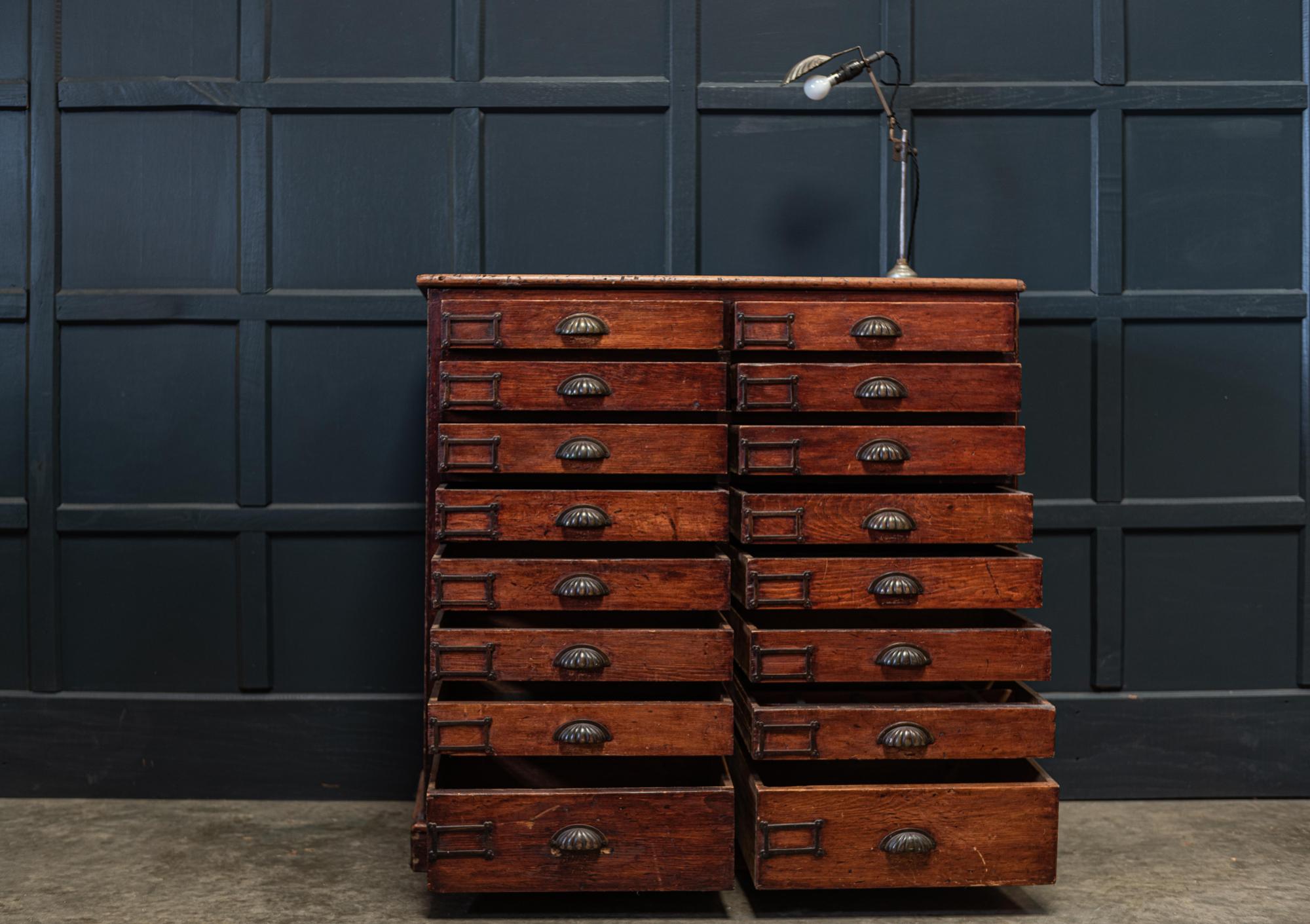 19th century English Haberdashery workshop bank of drawers,
circa 1890.

Oak top and pine carcass in original finish with 16 drawers (x2 large drawers at the base) and all original brass hardware. Lovely color and original