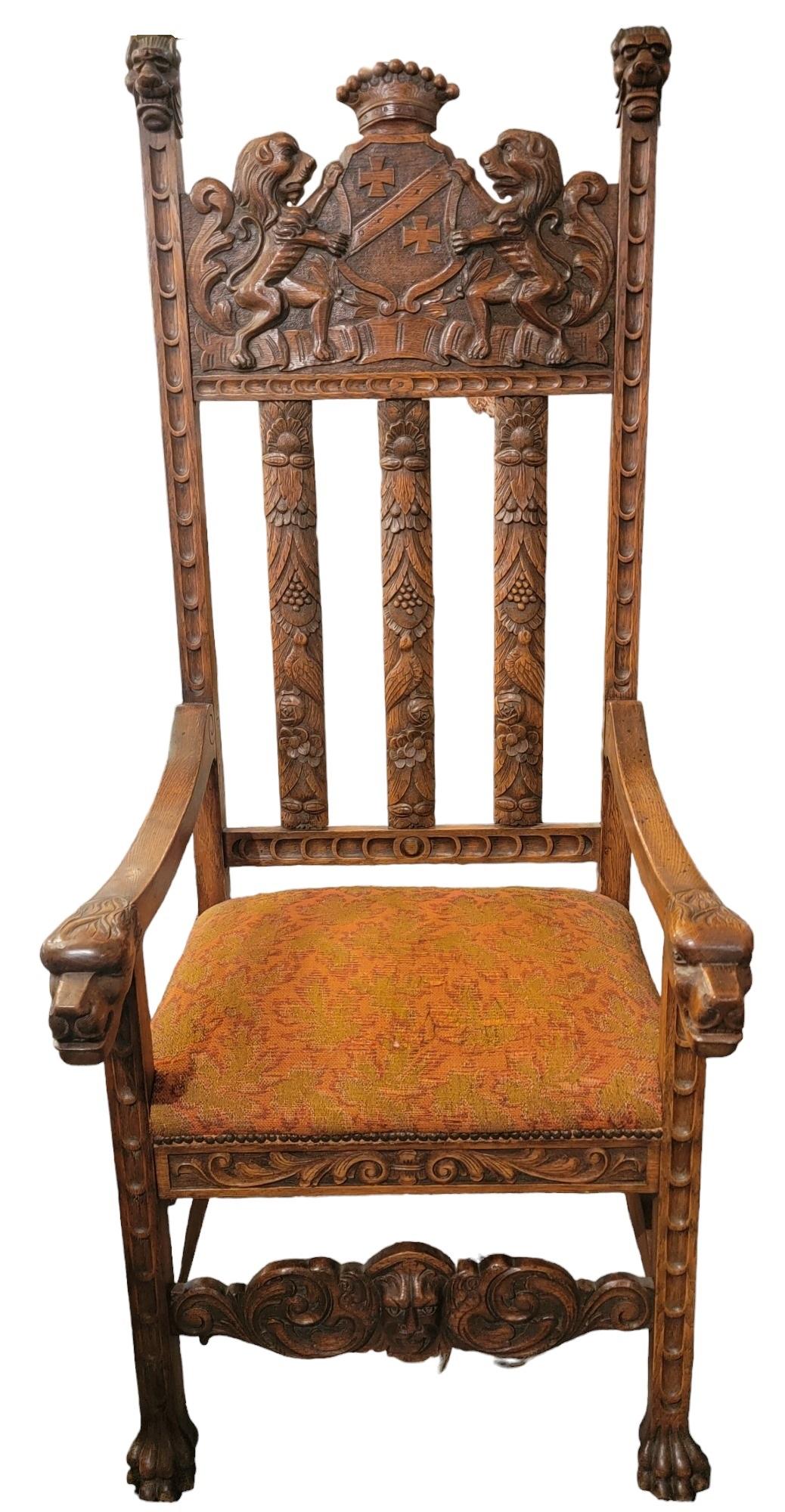 19thc English  Hand Carved Wooden Kings Chair. Wonderful design on the slats of the chairs. wonderful carving at the top of the chair has 2 lions holding a shield over/ behind the head of the person sitting.
Measures approx.  - 27d x 25w x 63.5h and