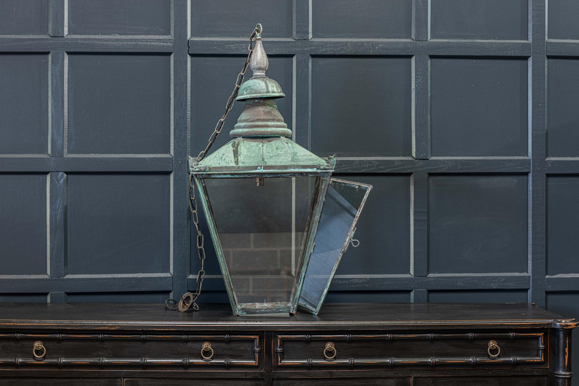19th century English large Verdigris glazed lantern
circa 1870.

With hinged door, comes with 1m of silk flex, 1m of heavy gauge antique brass chain and bronze ceiling hook.

Re-glazed rewired and pat tested - ready to hang.

Measures: H 90 x