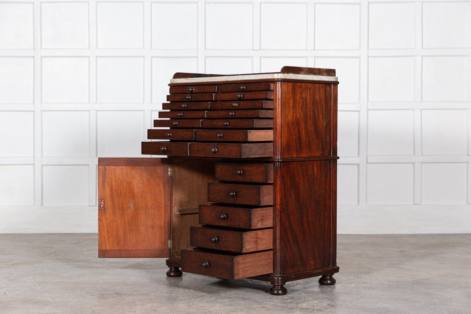 Circa 1860
19thC English Mahogany & Marble Top Collectors Cabinet with graduated drawers and false drawer cupboard door
An exceptional example
Measures: W 83 x D 47 x H 110 cm.
  