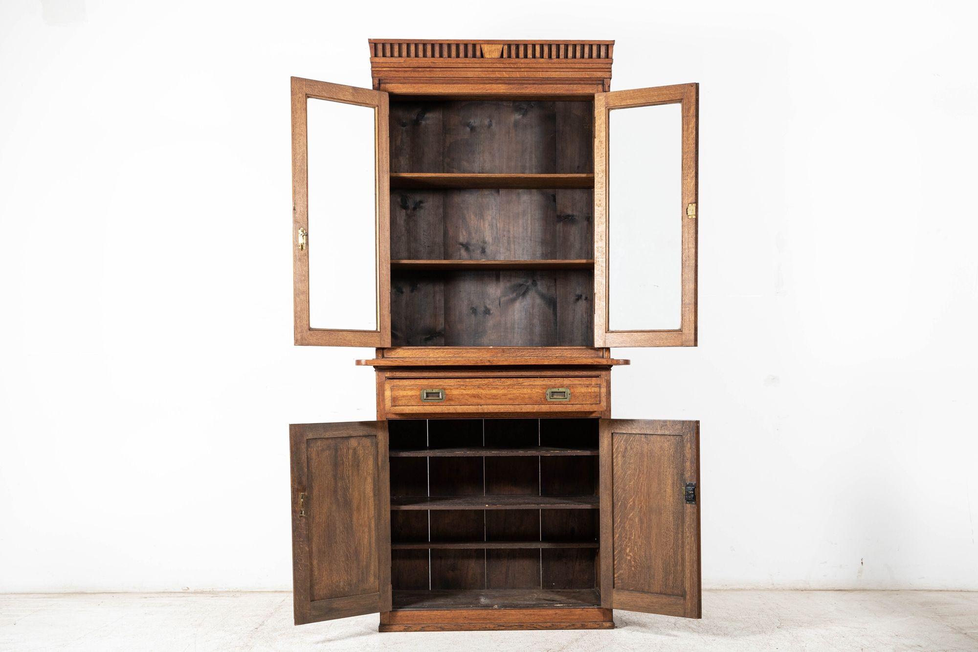 Circa 1890

19th C English oak estate bookcase cabinet. Excellent quality, colour and form with original hardware, locks and keys.

sku 1007

Measures: W 102 x D 42 x H 217 cm
Base W 102 x D 42 x H 101 cm
Top W 90 x D 33 x H 116 cm.