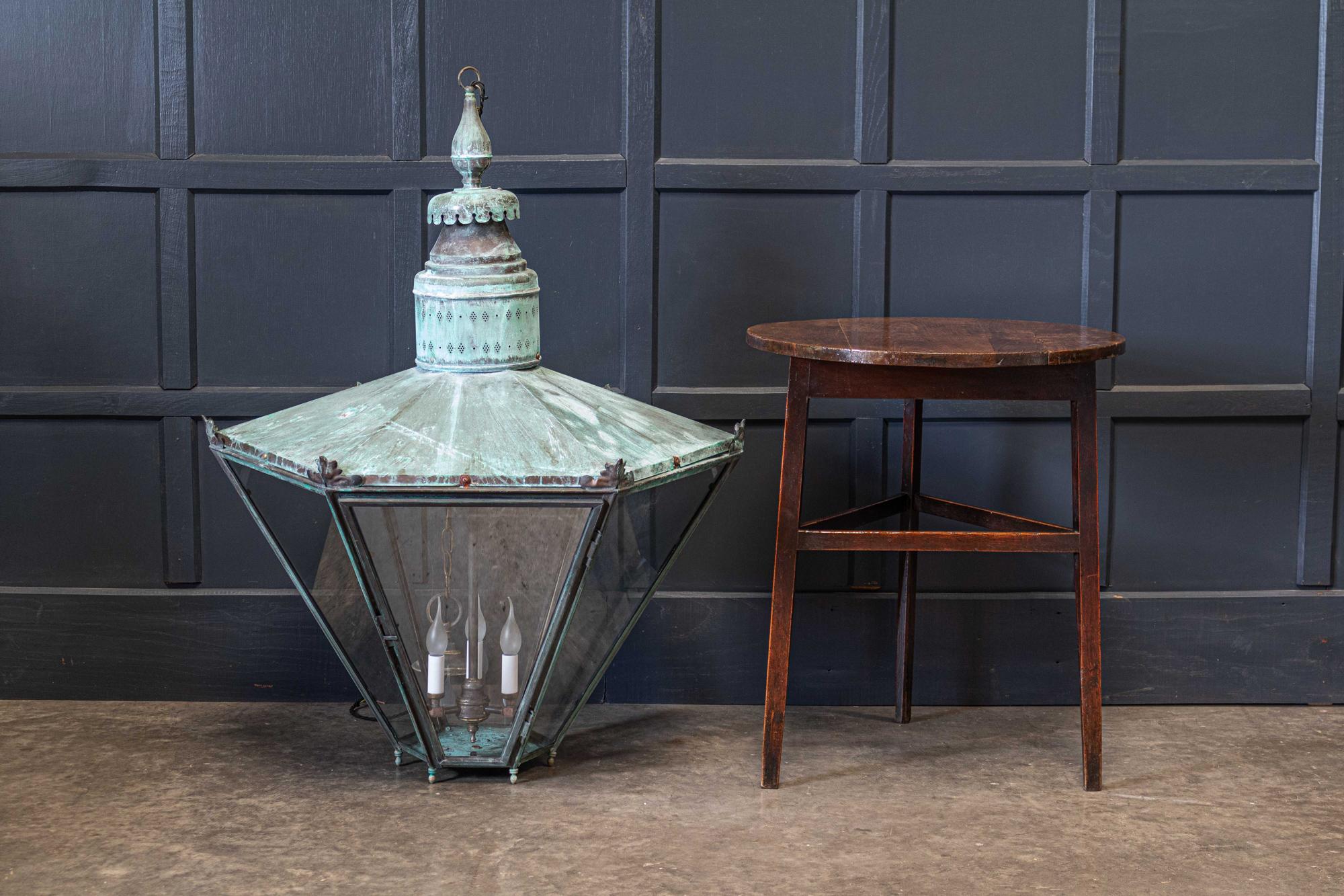 Circa 1850.

Exceptional 19thC English oversized hexagonal verdigris statement lantern with three candle bulb holder and hinged door.

Supplied with 1m of silk flex, 1m of heavy gauge antique brass chain & original ceiling hook.
Re-glazed