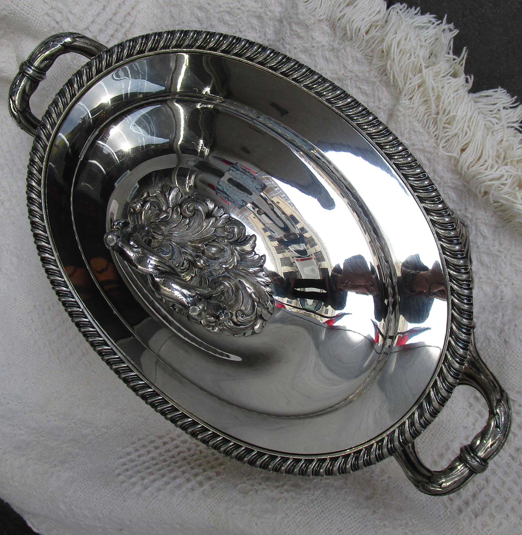 Sheffield silver large size tureen marked on the inside of the lid with a cross over a globe and the initials ITC which indicates it was made by Walker, Knowles and Co., 47 Burgess Street, London, England in 1840. The date puts it a little bit after