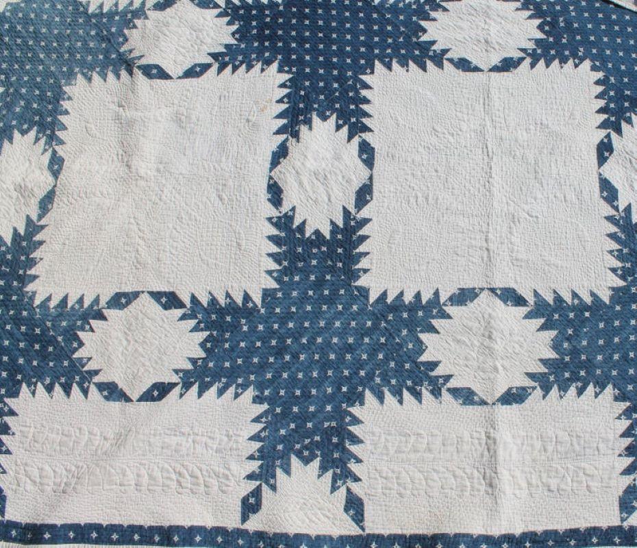 19th century fine blue & white feathered star quilt from Ohio. The quilt has fine piecing and quilting. Detailed quilting looks like stippled quilting. Wonderful Aged quilt in pristine condition. fine piecing and quilting a real collectors quilt.