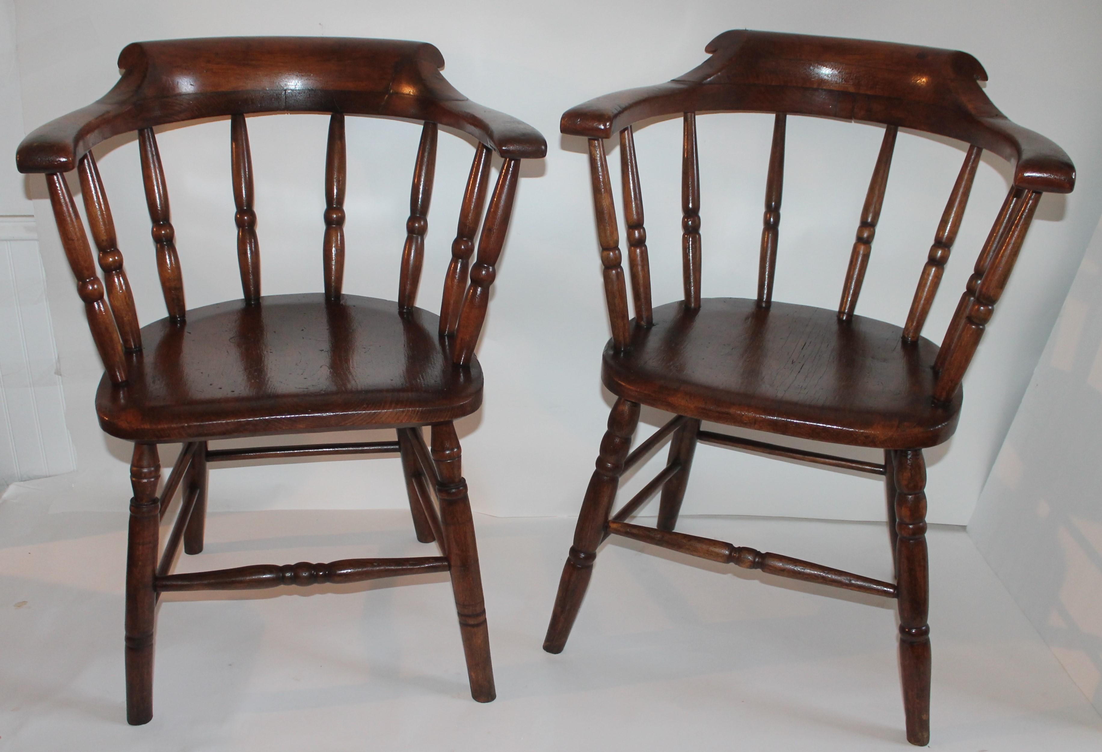 This pair of very early 19th century New England firehouse Windsor’s are in fine and sturdy condition. One is slightly different in carving then the other.