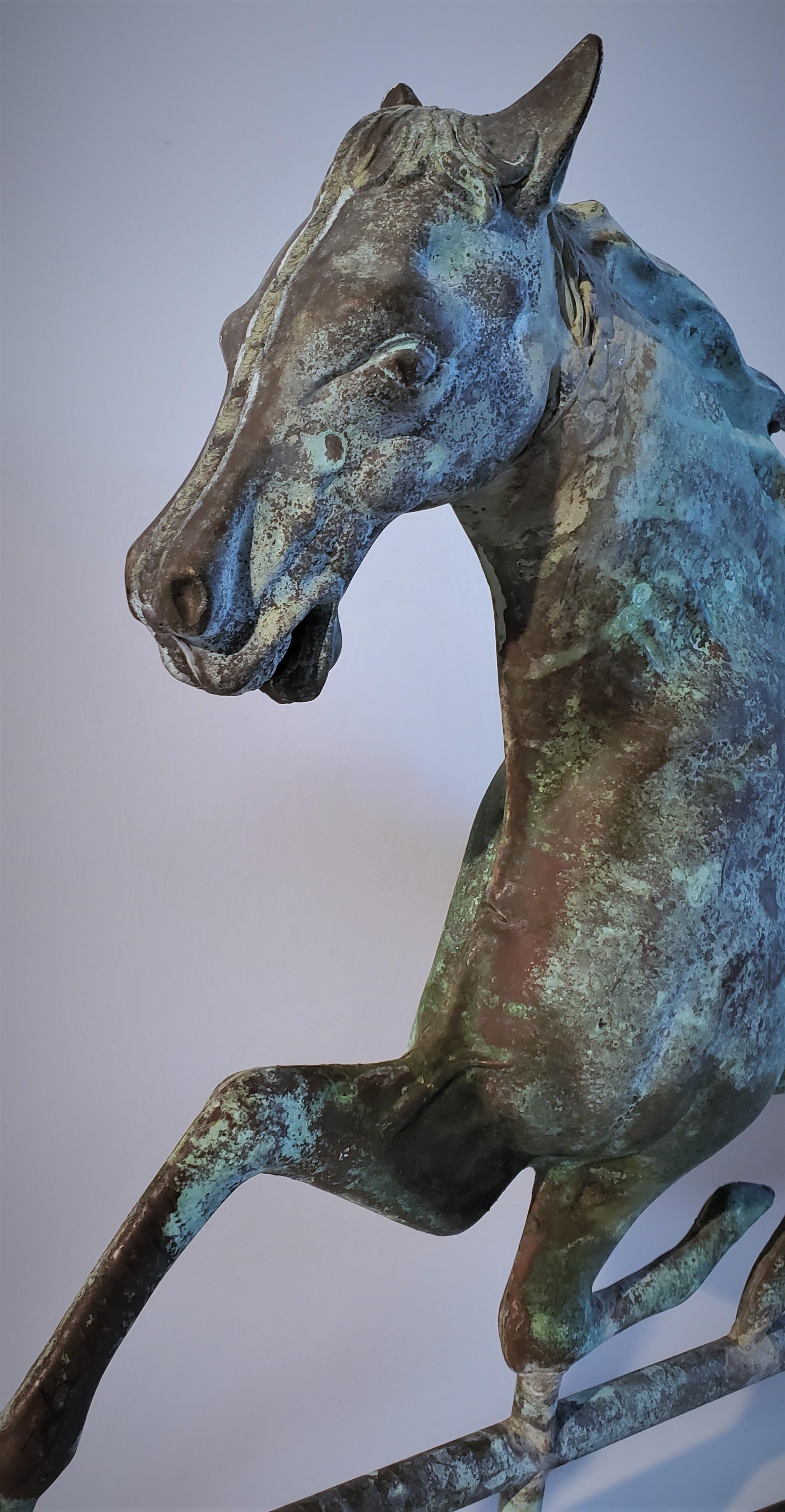This fantastic full body copper horse weather vane was made from the J.W. Fiske weather vane & garden urn company. This vane has an amazing undisturbed surface & patina. The condition is very good. It is sold with the cast iron stand.