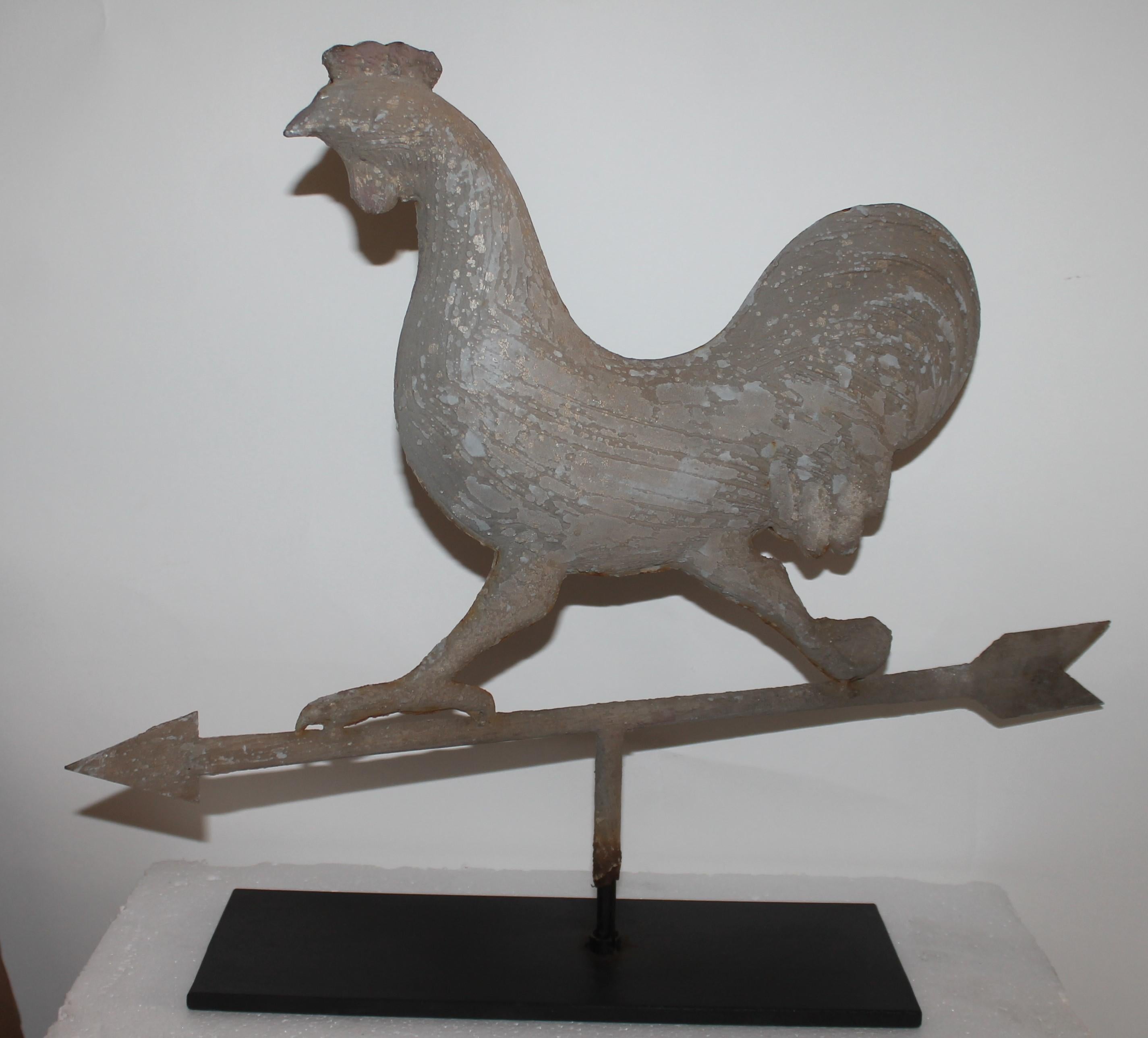This original painted full body folky chicken weather vane is painted a taupe painted surface and in good condition. It is mounted on a cast iron custom made base.