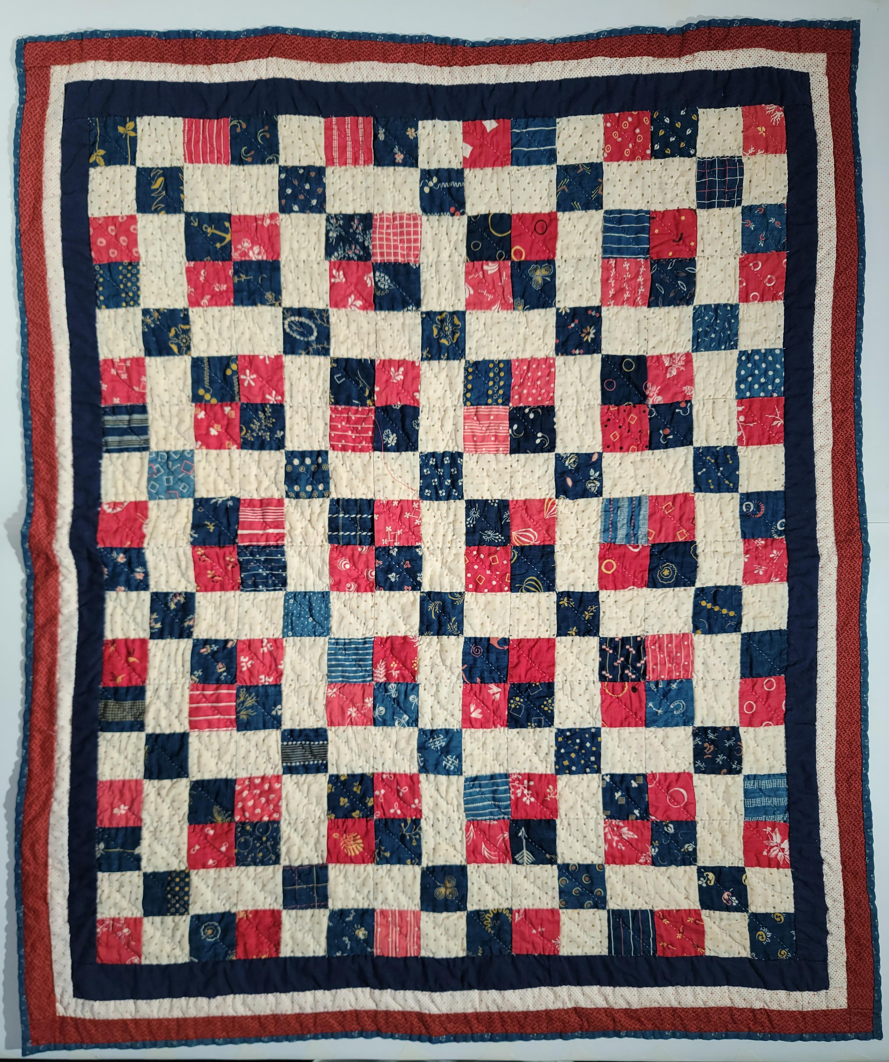19th century Patriotic four patch crib quilt from Ohio.The condition is very good and has great inner borders.
