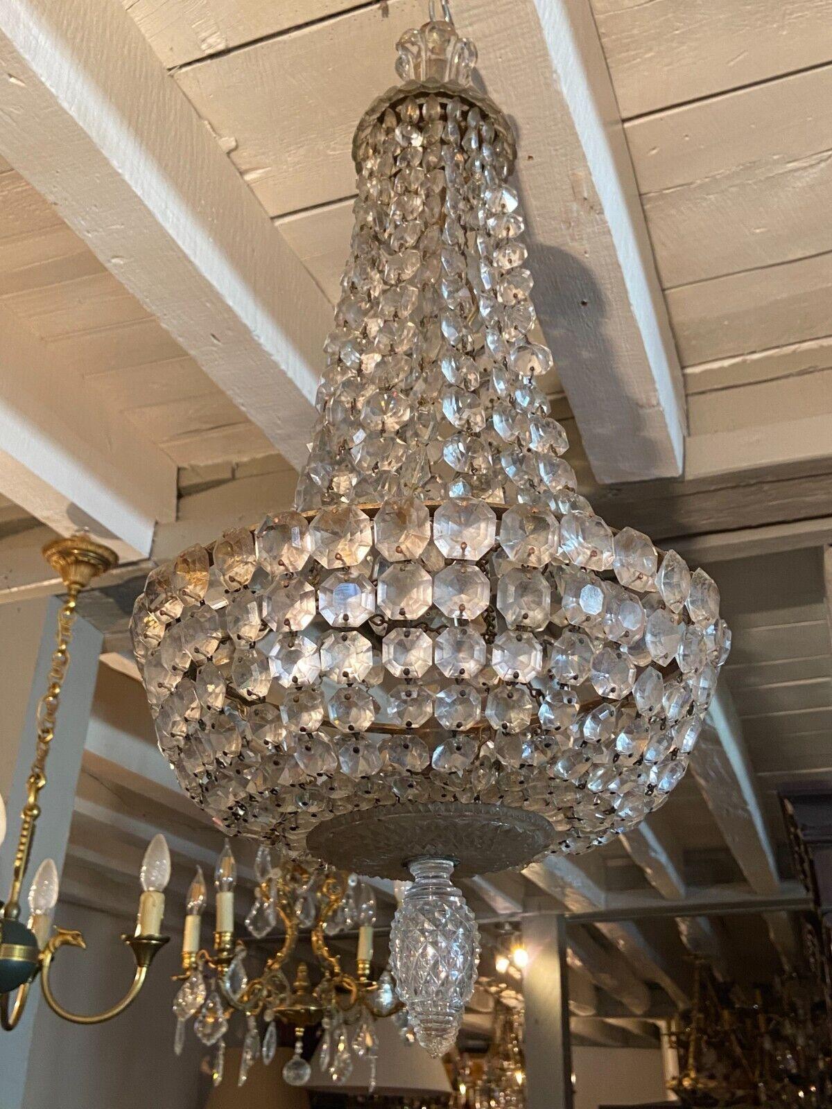 Absolutely Beautiful 19thc French Empire Cascading Cyt Crystal Bag and Tent Form Chandelier attributed to Baccarat France. This is an exceptional piece, the detailed crystal elements are of a rare form. Parisian estate acquisition.