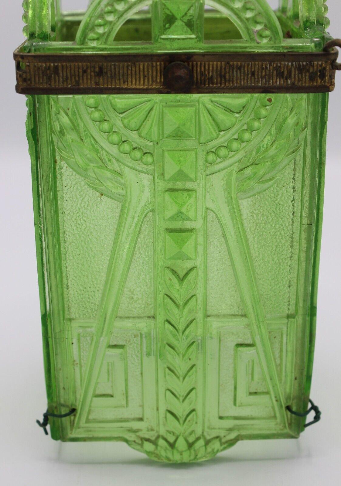 19thc French Empire Intricately Patterned Green Art Glass Lantern with Bronze Element. Lovely antique lantern which will arrive newly electrified and with 15 inches of chain and ceiling canopy. Gilt bronze banding accent with one small knob switched.